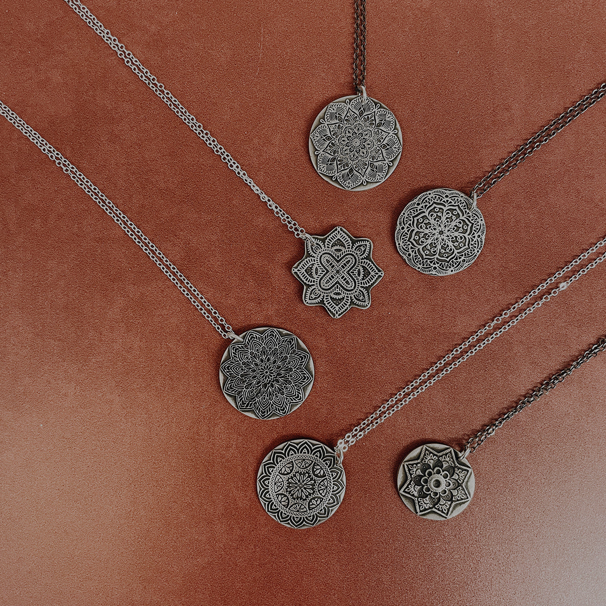 Handcrafted sterling silver mandala pendant necklaces and floral earrings — nature inspired mandala jewelry by Jester Swink, Santa Cruz Mountains California