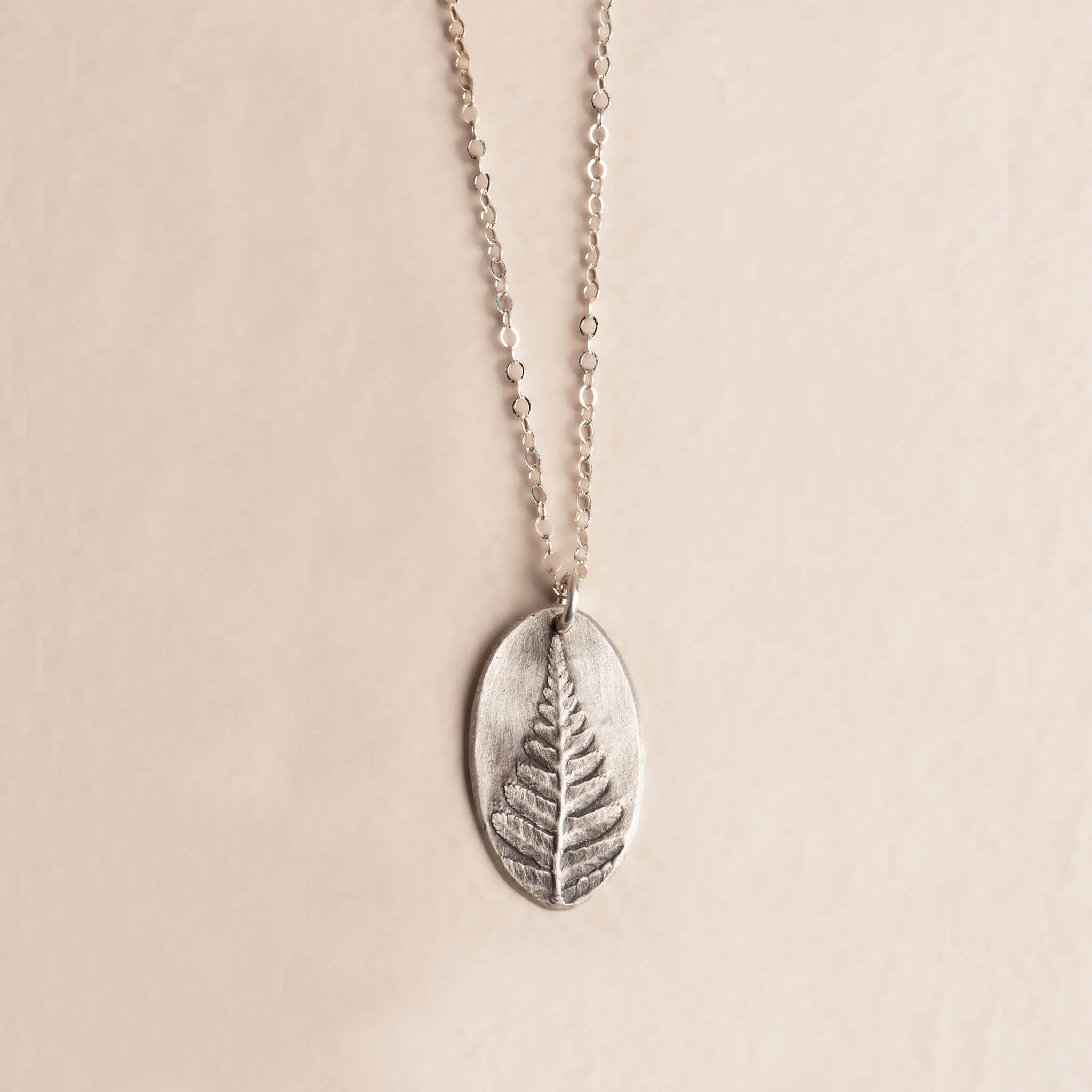 Handcrafted sterling silver fern pendant necklace on silver chain, Wild Impressions botanical jewelry, Jester Swink