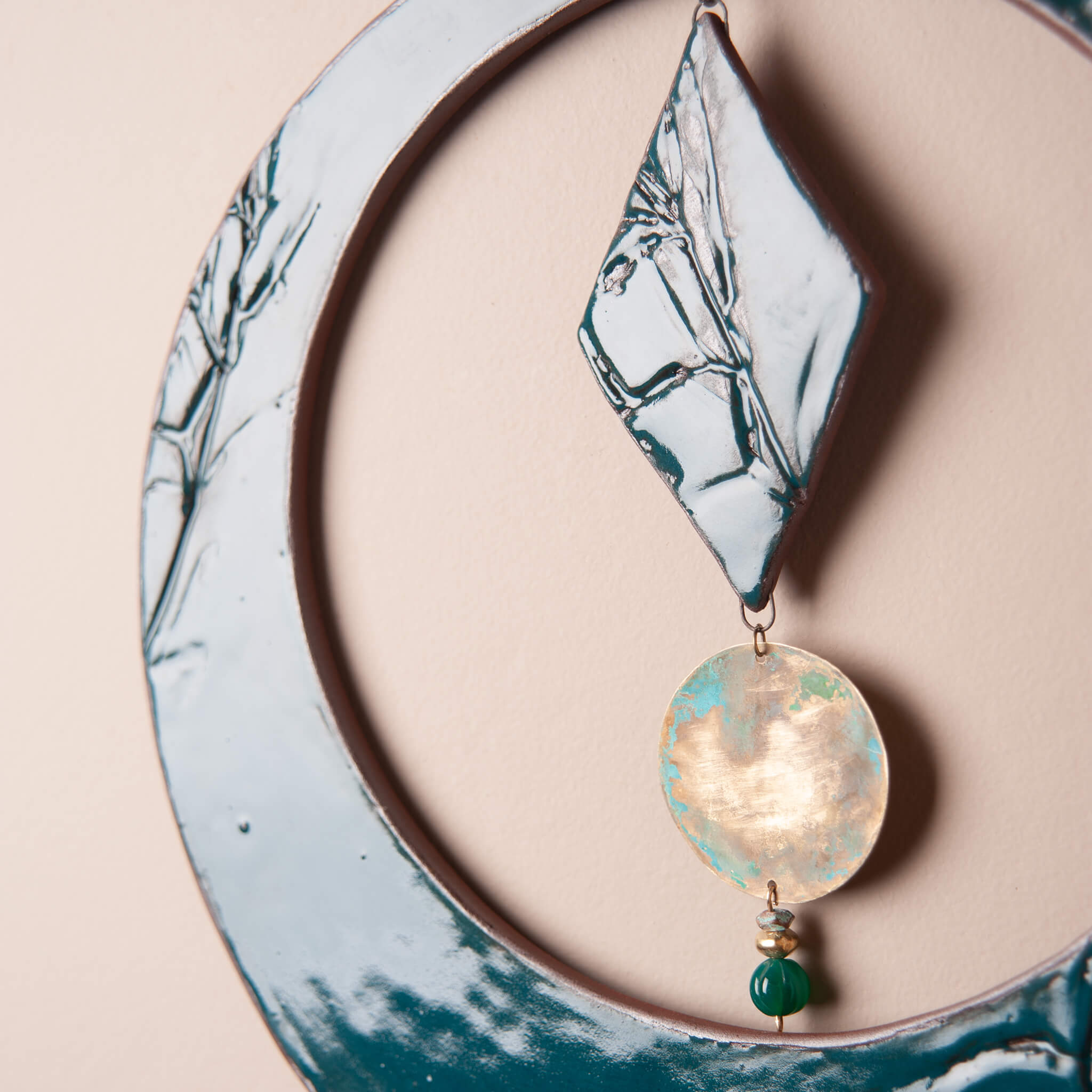 Hand patinated brass disc and green onyx drop on handmade ceramic wall hanging From the Fire FTF_0726 by Jester Swink