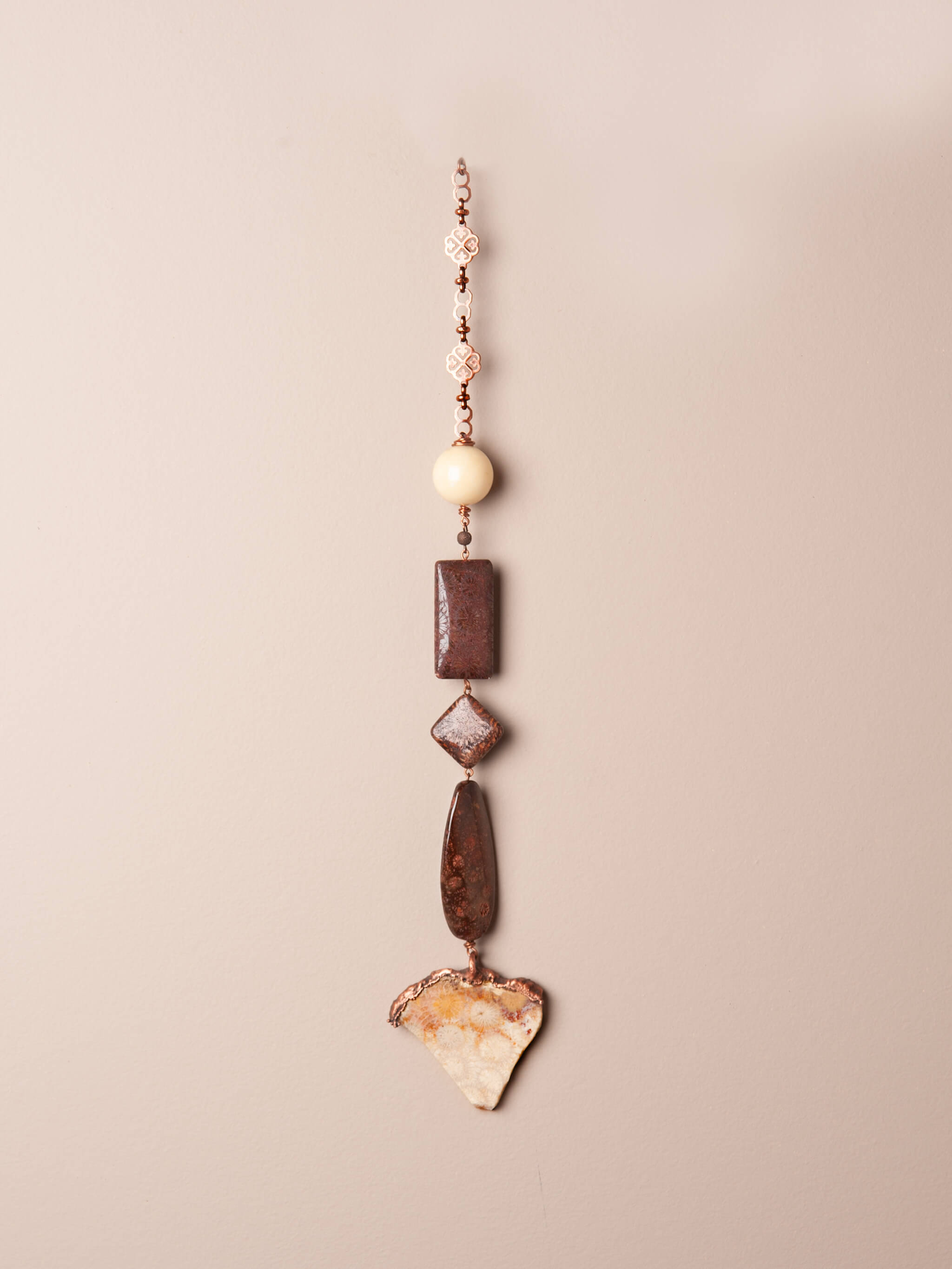 Handcrafted fossilized coral agate wall hanging electroformed in copper with hand-gathered beads — Fossil Tide by Jester Swink, wall art and wind spinner