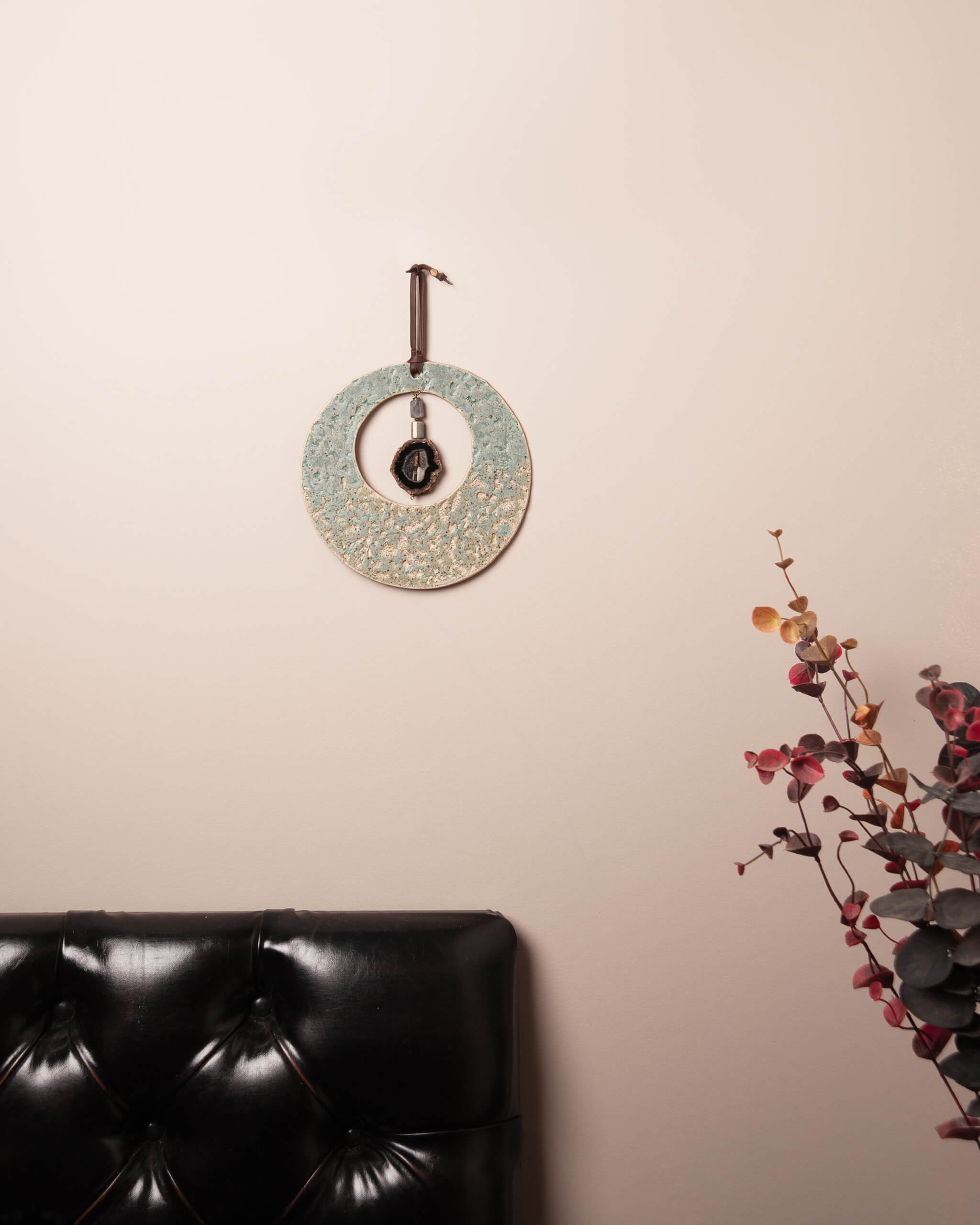 Abalone Moon handmade ceramic wall art with druzy agate center and labradorite in natural home setting