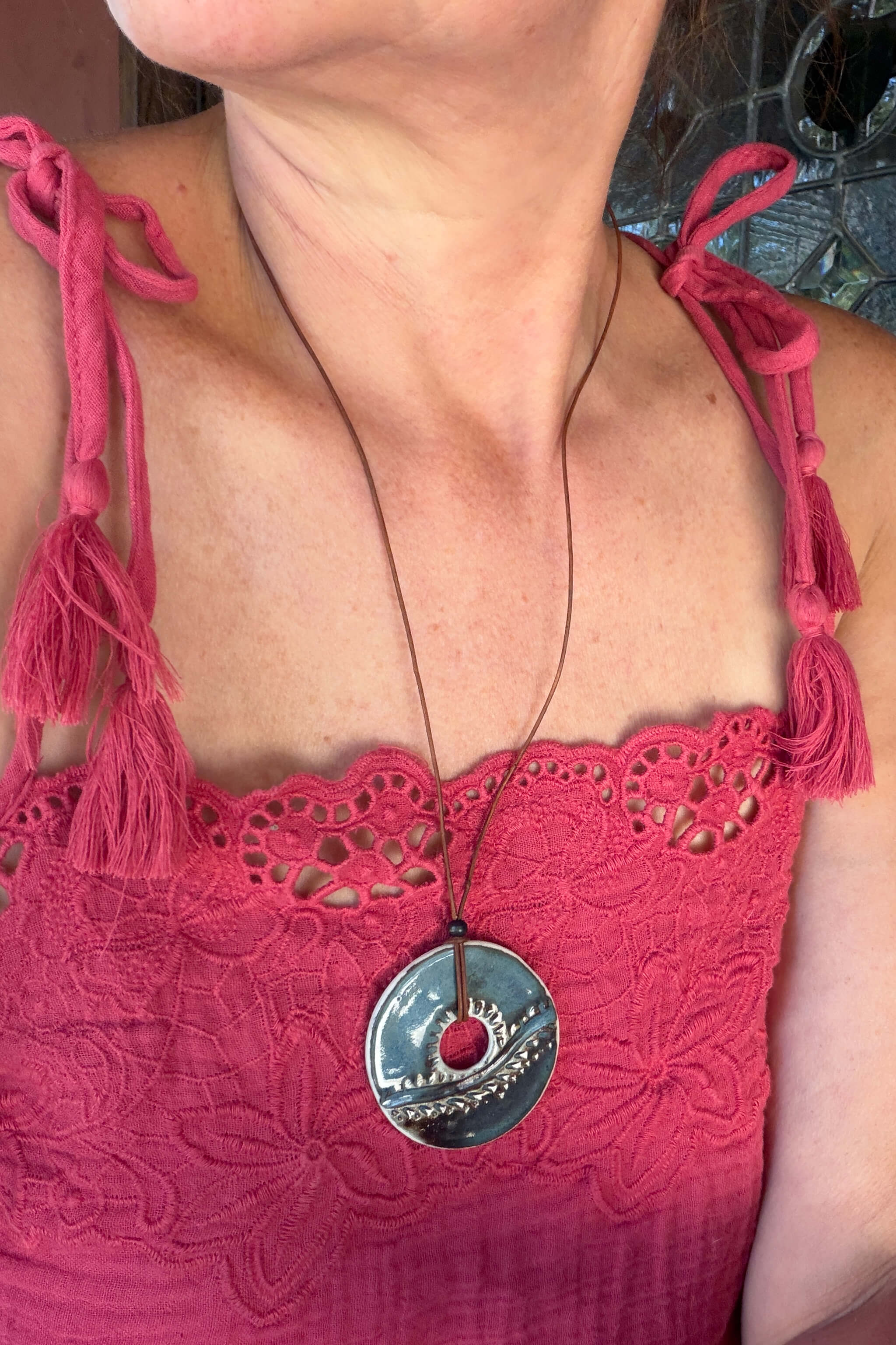 Handmade blue and brown ceramic horizon sunrise pendant necklace worn at long boho length on caramel leather — coastal ceramic jewelry From the Fire FTF_0726 by Jester Swink