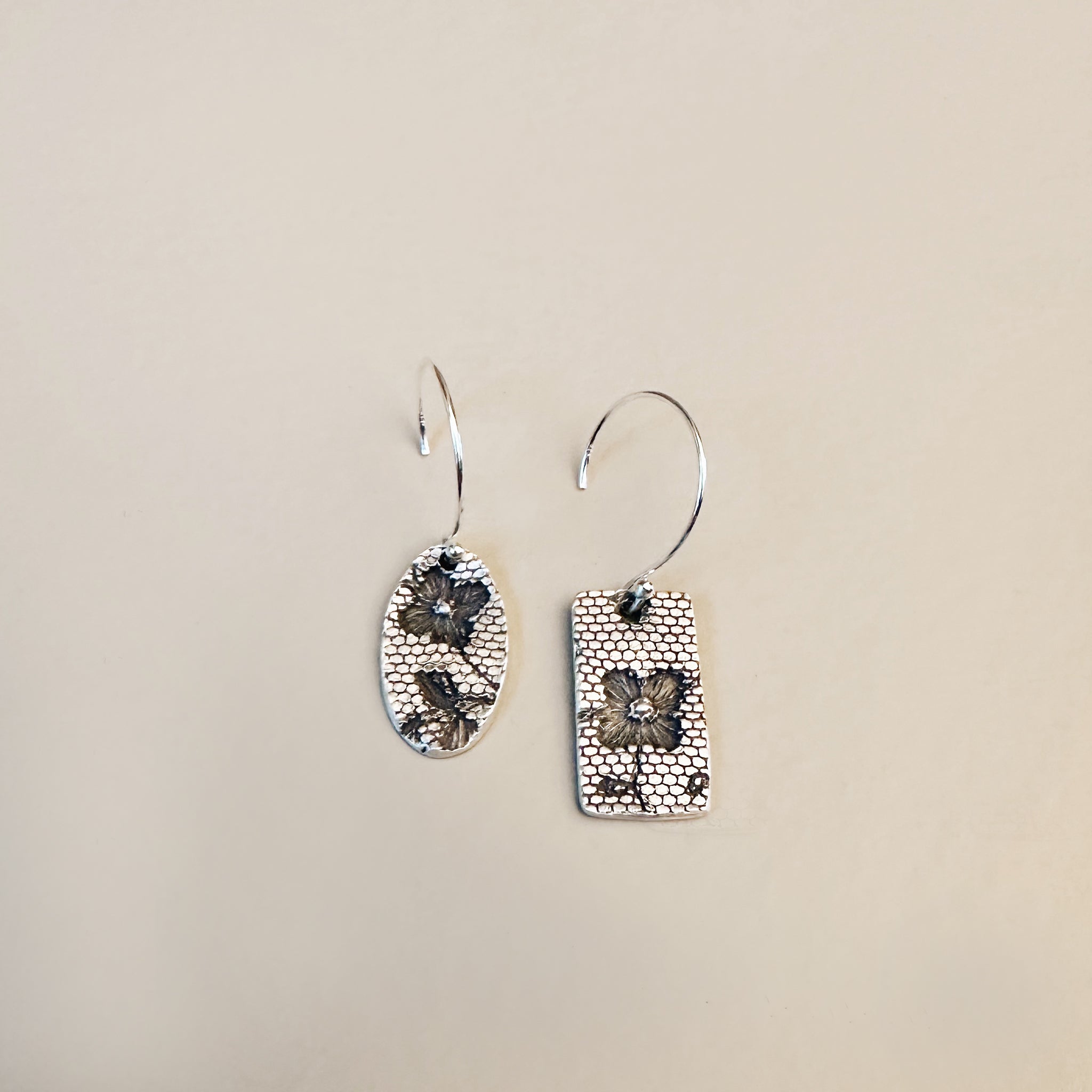 Handcrafted sterling silver dangle earrings with real lace texture impression โ Lace Bloom Earrings by Jester Swink, Santa Cruz Mountains