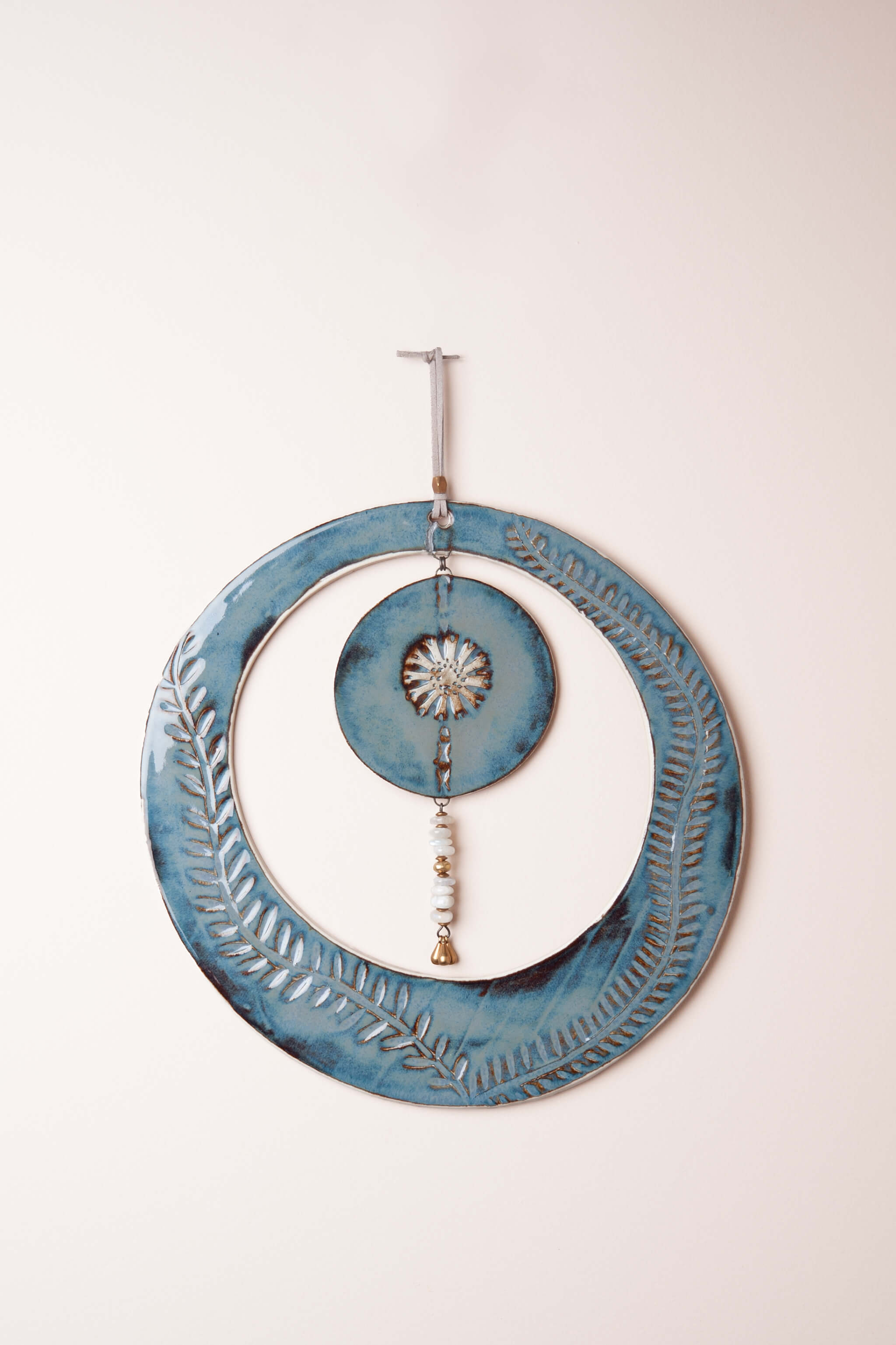 Large handmade circle ceramic wall art in night sky blue with vine leaf pattern and moonstone drop, kiln fired by Jester Swink Santa Cruz Mountains — Jester's Wink From the Fire FTF_0726