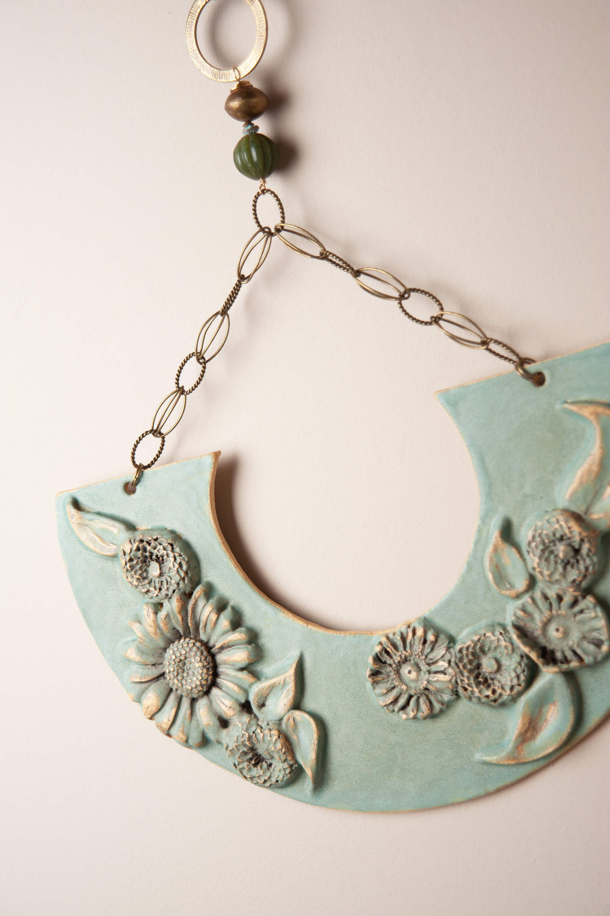 Brass chain and serpentine bead on large handmade floral ceramic wall plaque From the Fire FTF_0726 by Jester Swink