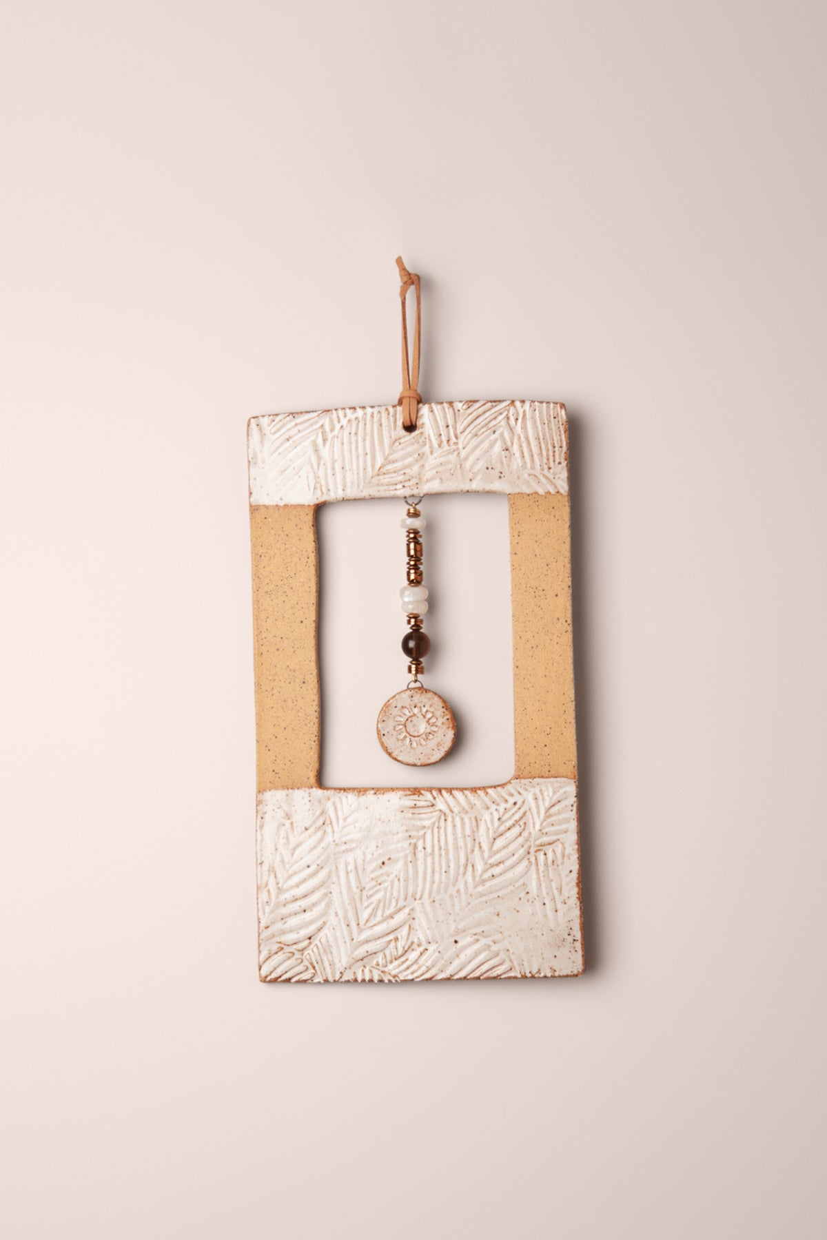Large handmade rectangle ceramic wall hanging in white glaze with pressed leaves and a moonstone, smoky topaz and copper hematite dangle, kiln fired by Jester Swink Santa Cruz Mountains — From the Fire FTF_1026