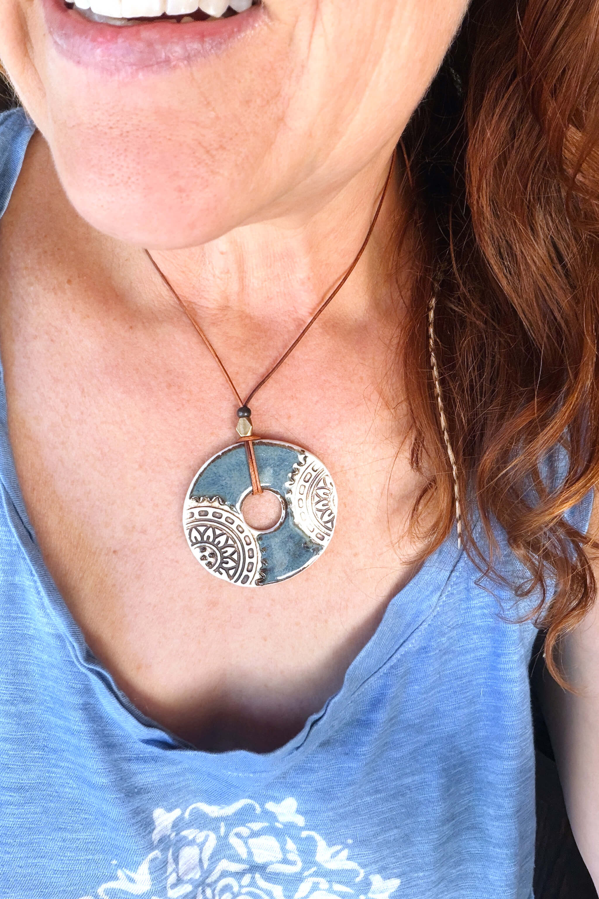 Handmade porcelain mandala ceramic pendant necklace worn at shorter length — boho mandala ceramic jewelry From the Fire FTF_0726 by Jester Swink