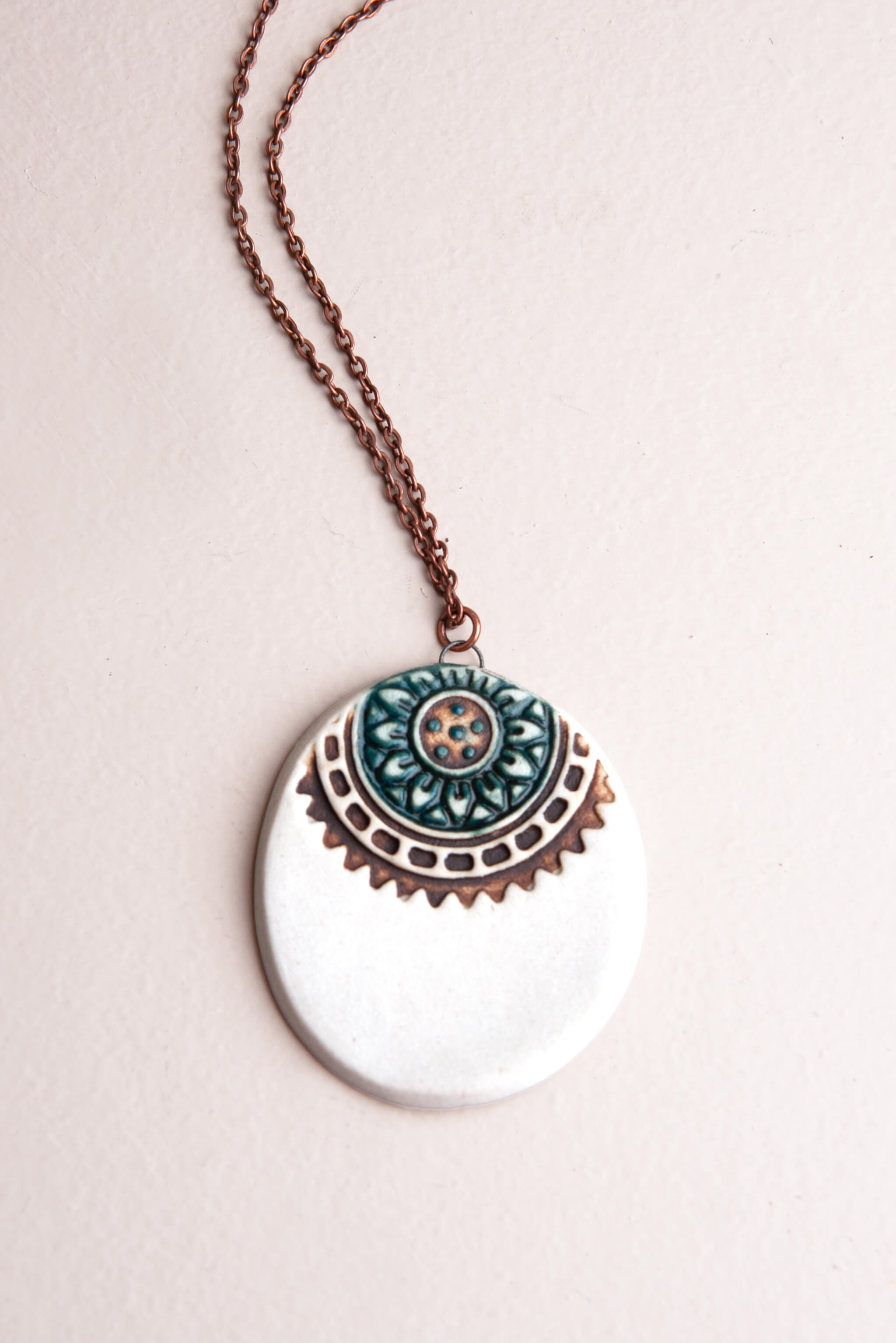 Handmade white porcelain mandala crown ceramic pendant necklace in sea breeze blue on an 18 inch copper chain, kiln fired by Jester Swink Santa Cruz Mountains — From the Fire FTF_0726