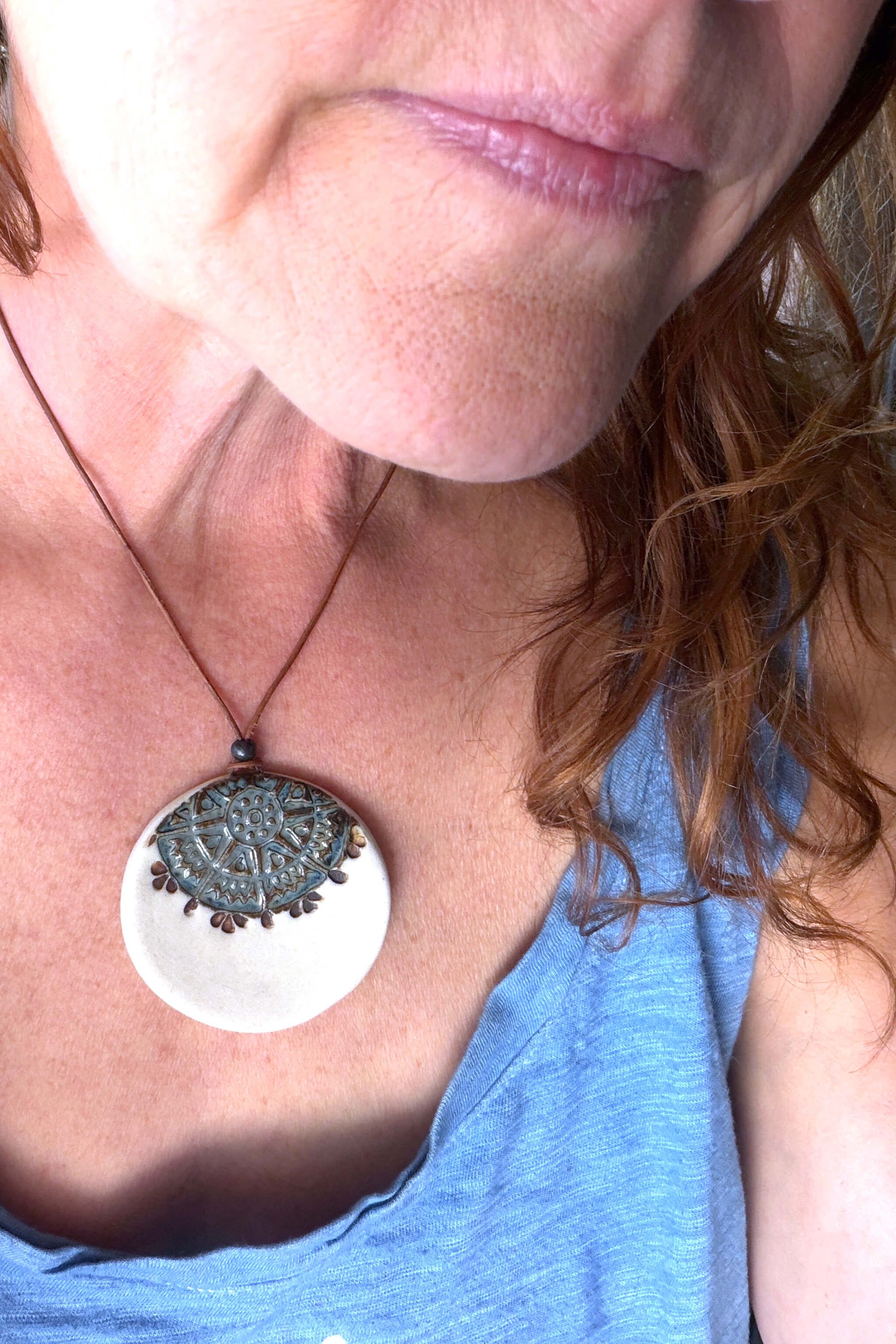 Handmade porcelain mandala tile ceramic pendant necklace in antique aqua worn at shorter length — vintage inspired ceramic jewelry From the Fire FTF_0726 by Jester Swink