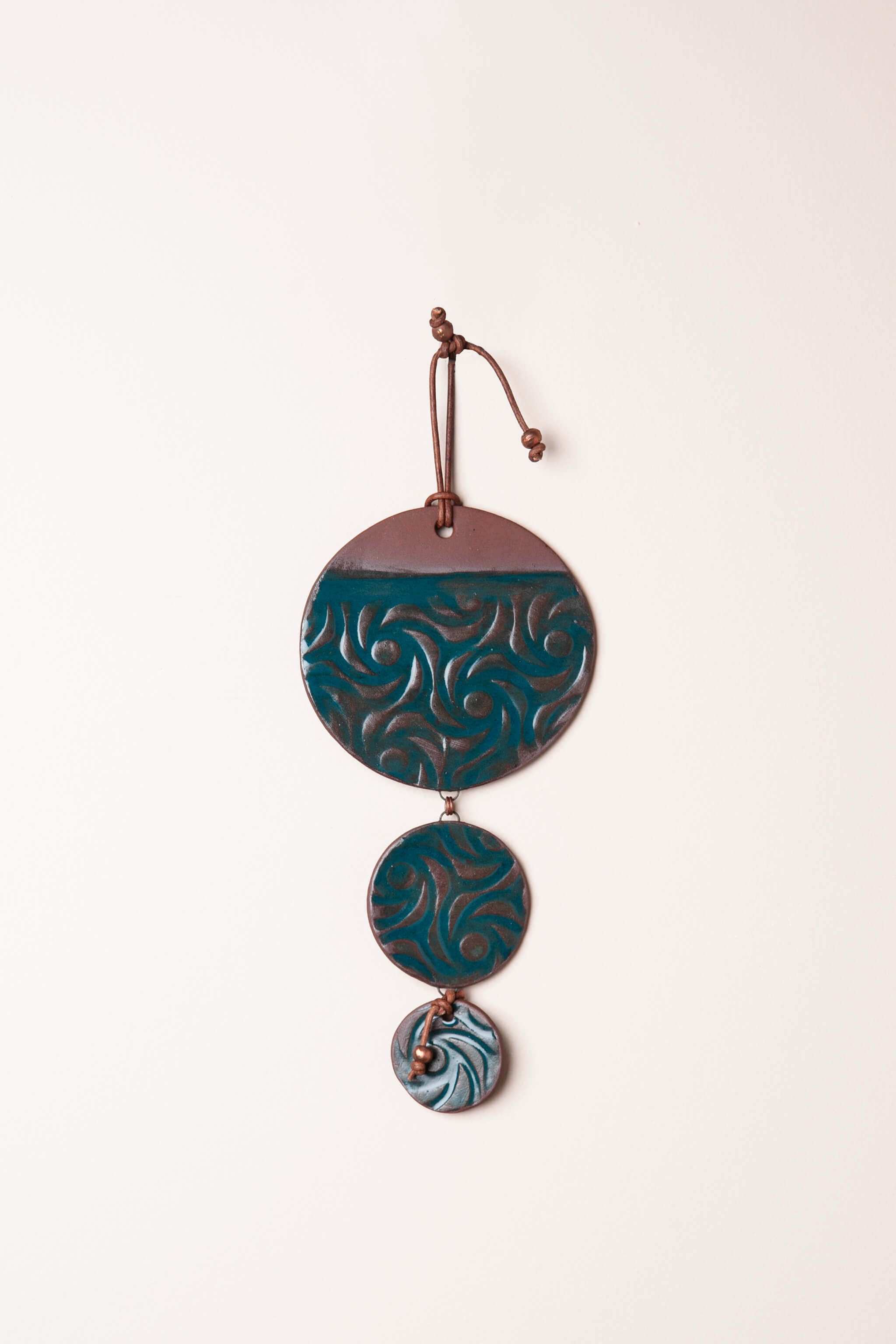 Medium handmade cascading ceramic wall hanging in marine teal with metallic sheen and swirl pattern, kiln fired by Jester Swink Santa Cruz Mountains — From the Fire FTF_0726