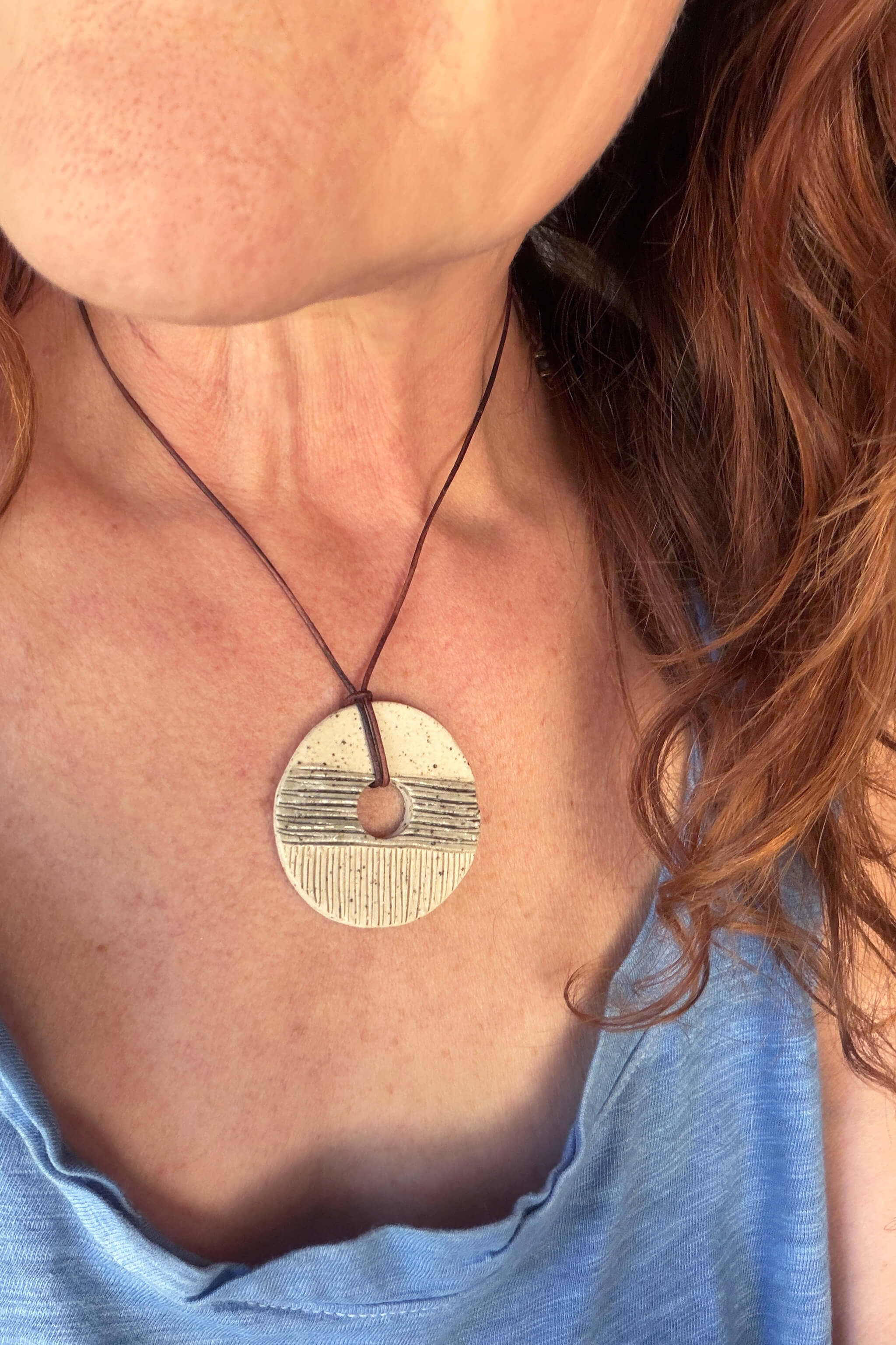Handmade small speckled ceramic pendant necklace with carved rows worn at shorter length — minimalist ceramic jewelry From the Fire FTF_0726 by Jester Swink