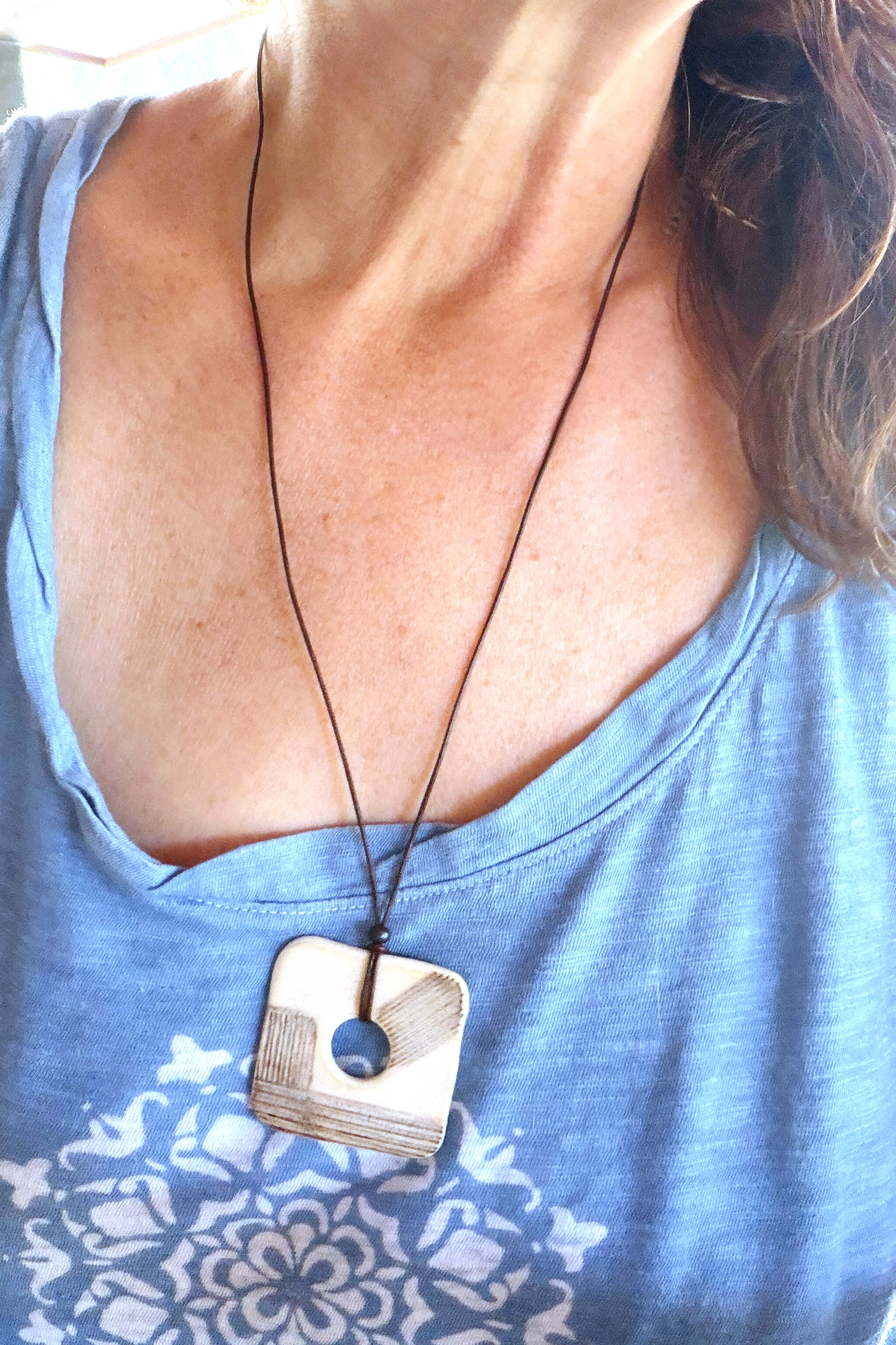 Handmade modern ceramic square pendant necklace worn at long boho length on dark Italian leather — From the Fire FTF_0726 by Jester Swink
