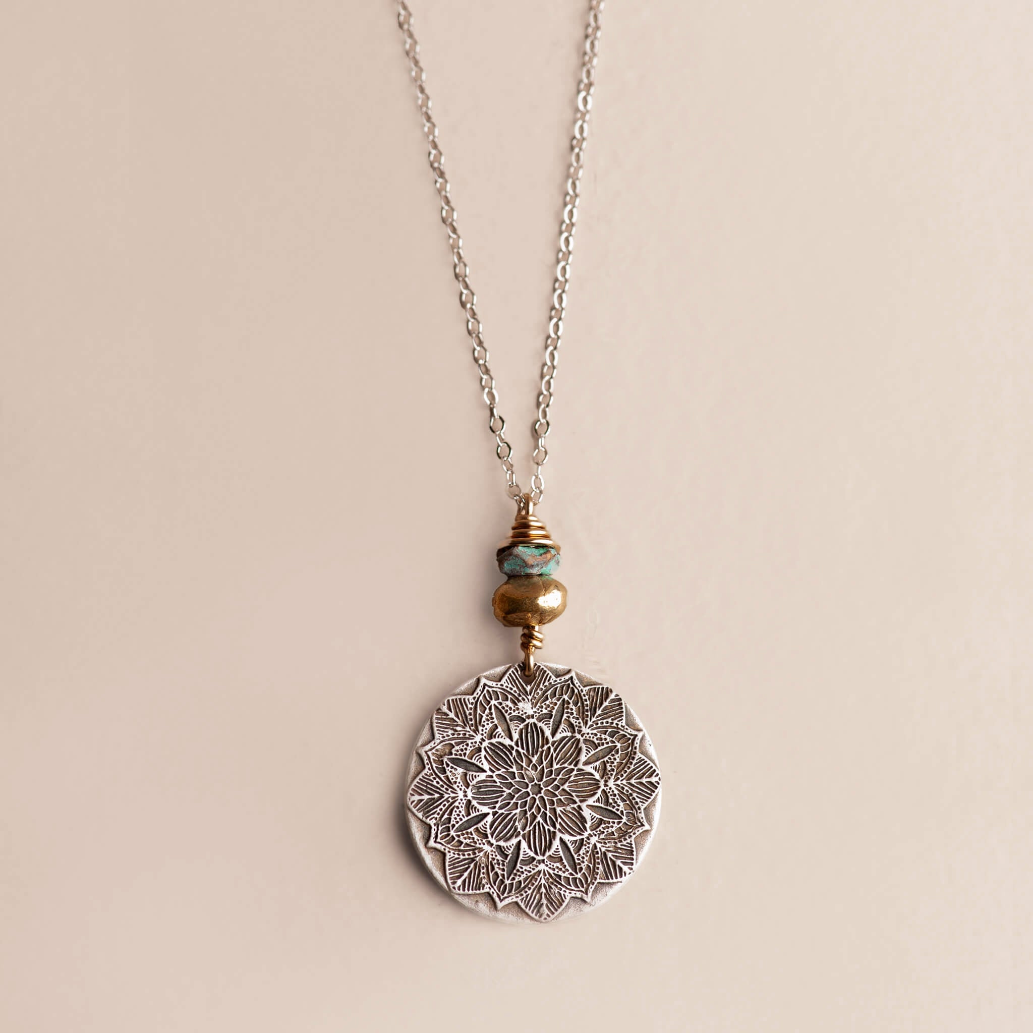 Handcrafted sterling silver mandala pendant necklace with turquoise patina brass and 14K gold-fill — mixed metal mandala jewelry by Jester Swink, Santa Cruz Mountains
