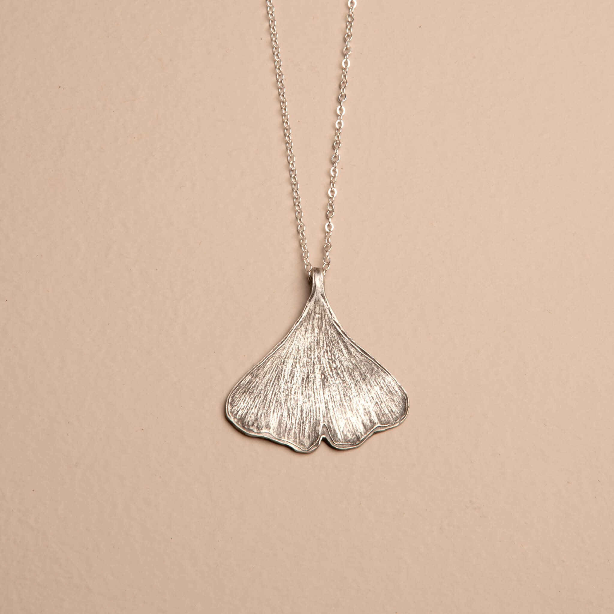 Handcrafted sterling silver ginkgo leaf necklace with botanical imprint pendant on delicate chain