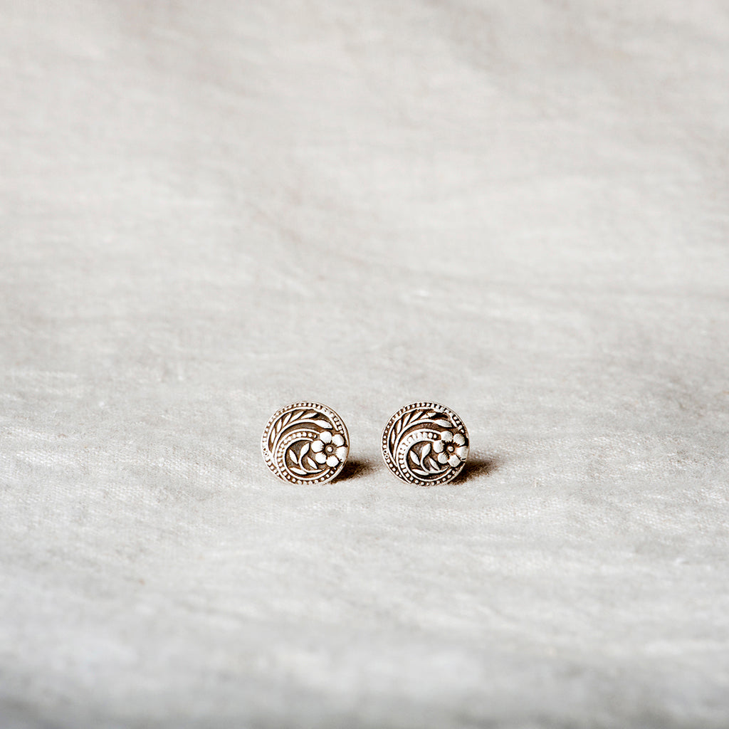 Handcrafted sterling silver flower stud earrings pressed from a vintage button mold โ Vintage Charm Studs by Jester Swink, Santa Cruz Mountains