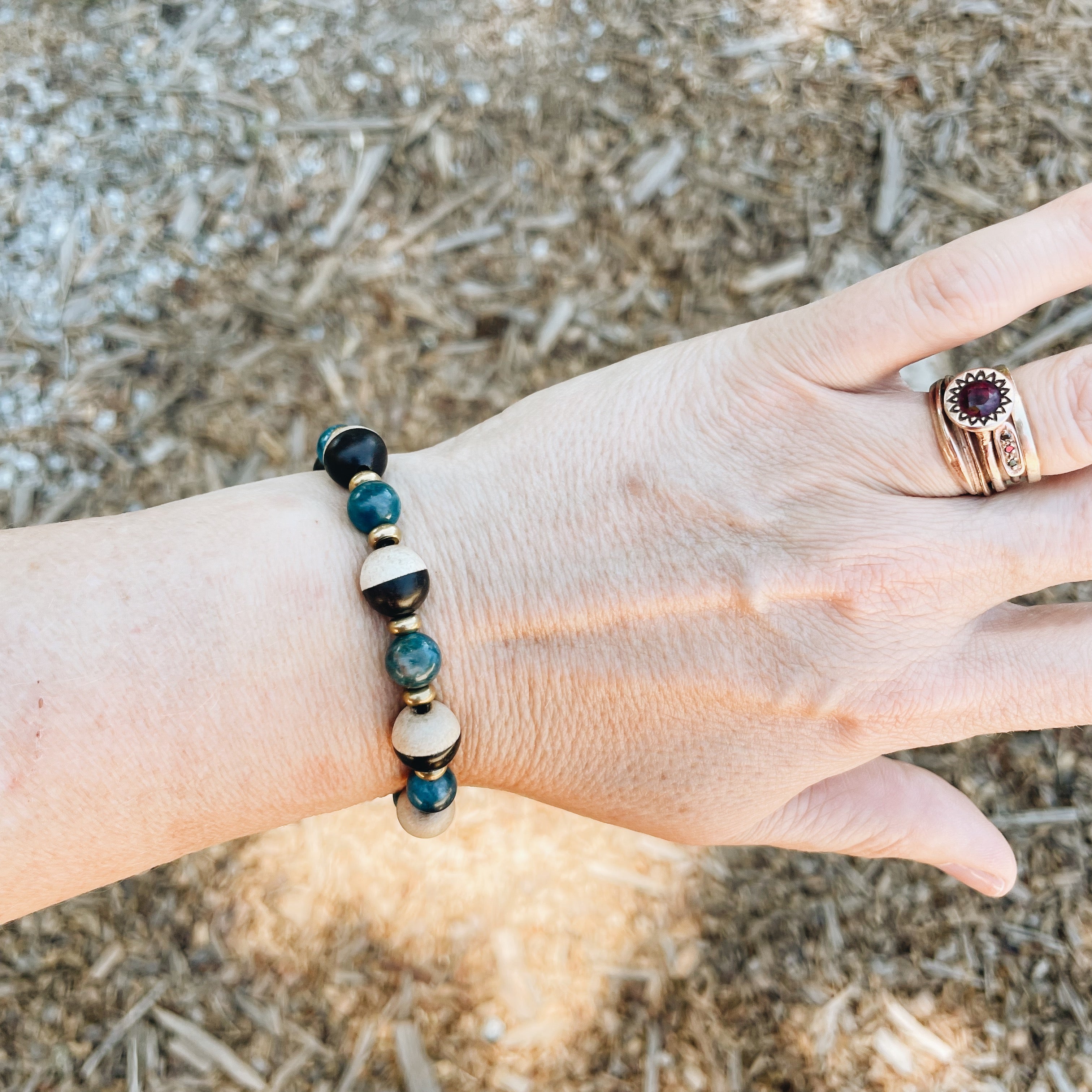 Apatite, White & Ebony Wood, Skull, and Brass Bracelet by Jester Swink - Jester Swink