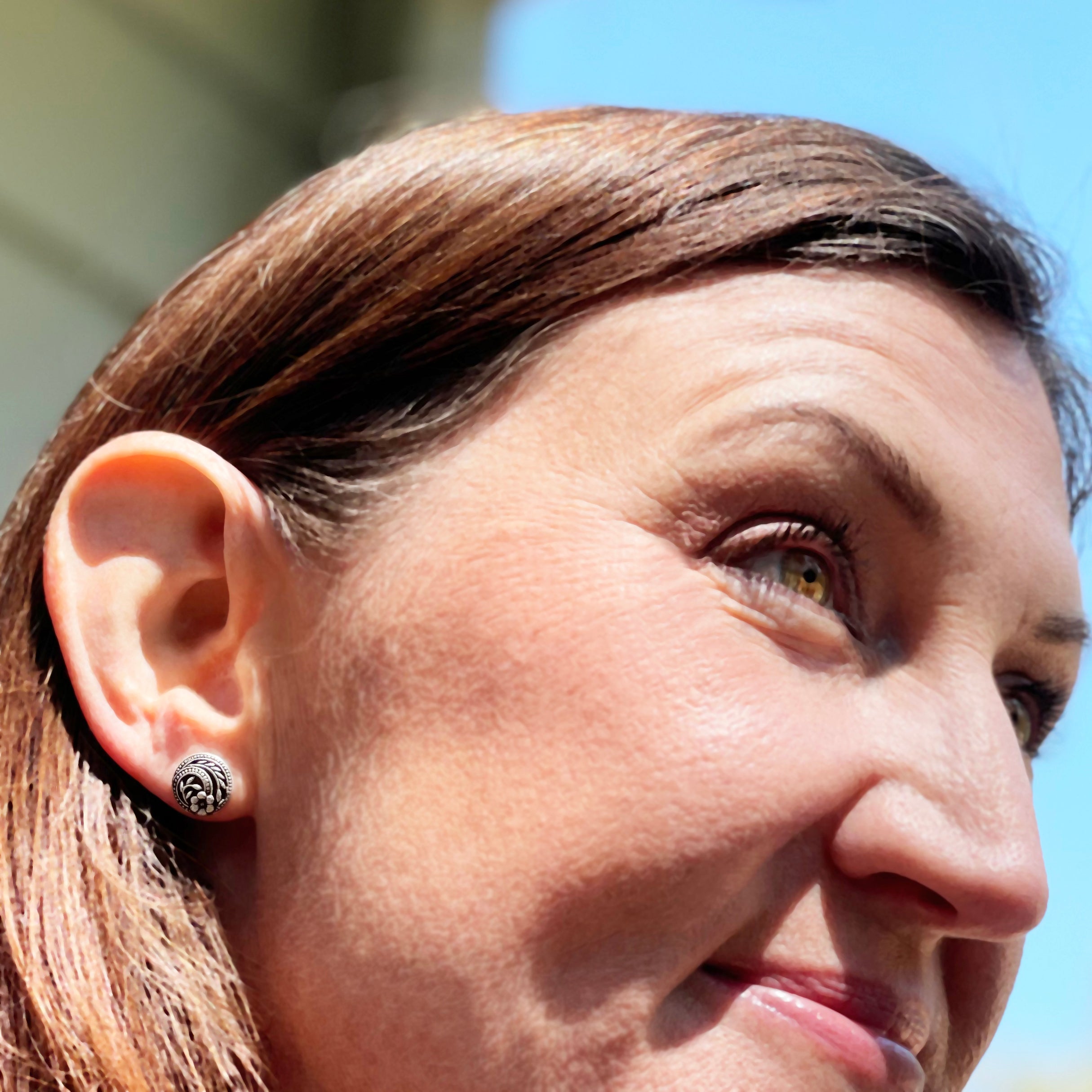 Silver Flower Stud Earrings on model