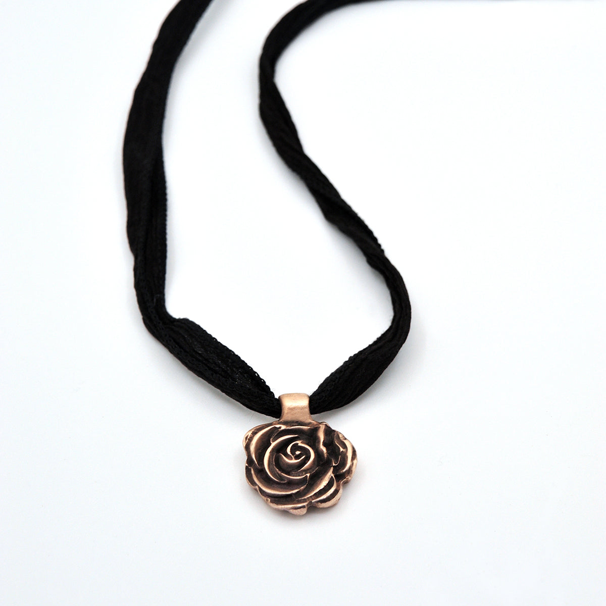 Handcrafted Bronze Rose Pendant Necklace on Silk Cording