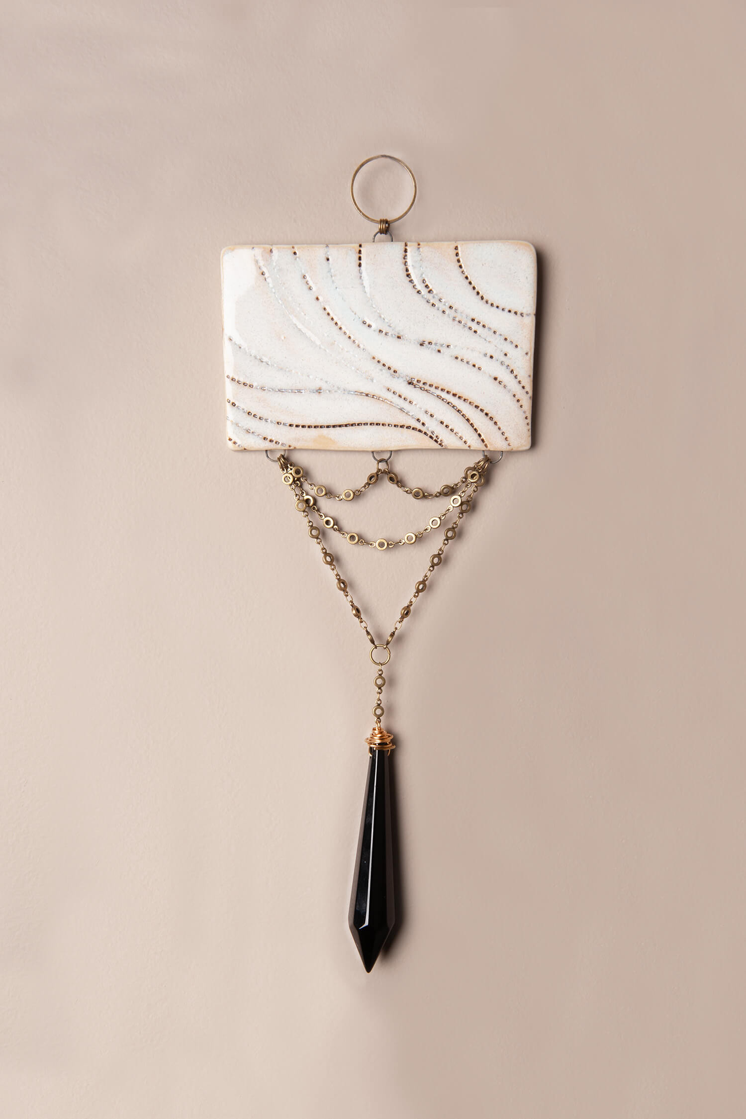 Draped Horizon – Handcrafted Ceramic Wall Hanging with Black Crystal, 10.75"