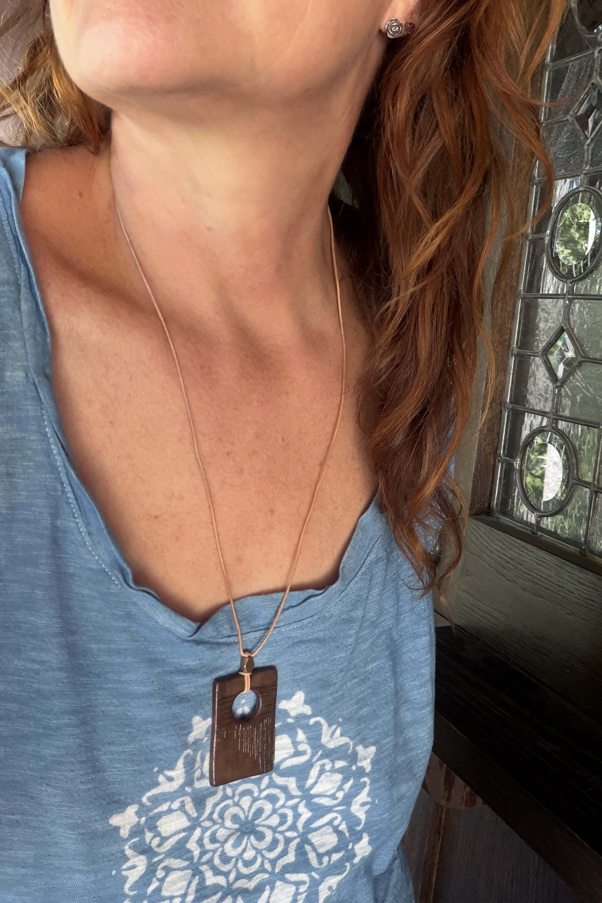 Handmade chocolate brown ceramic rectangle pendant necklace worn long on natural leather — modern minimalist ceramic jewelry From the Fire FTF_0726 by Jester Swink