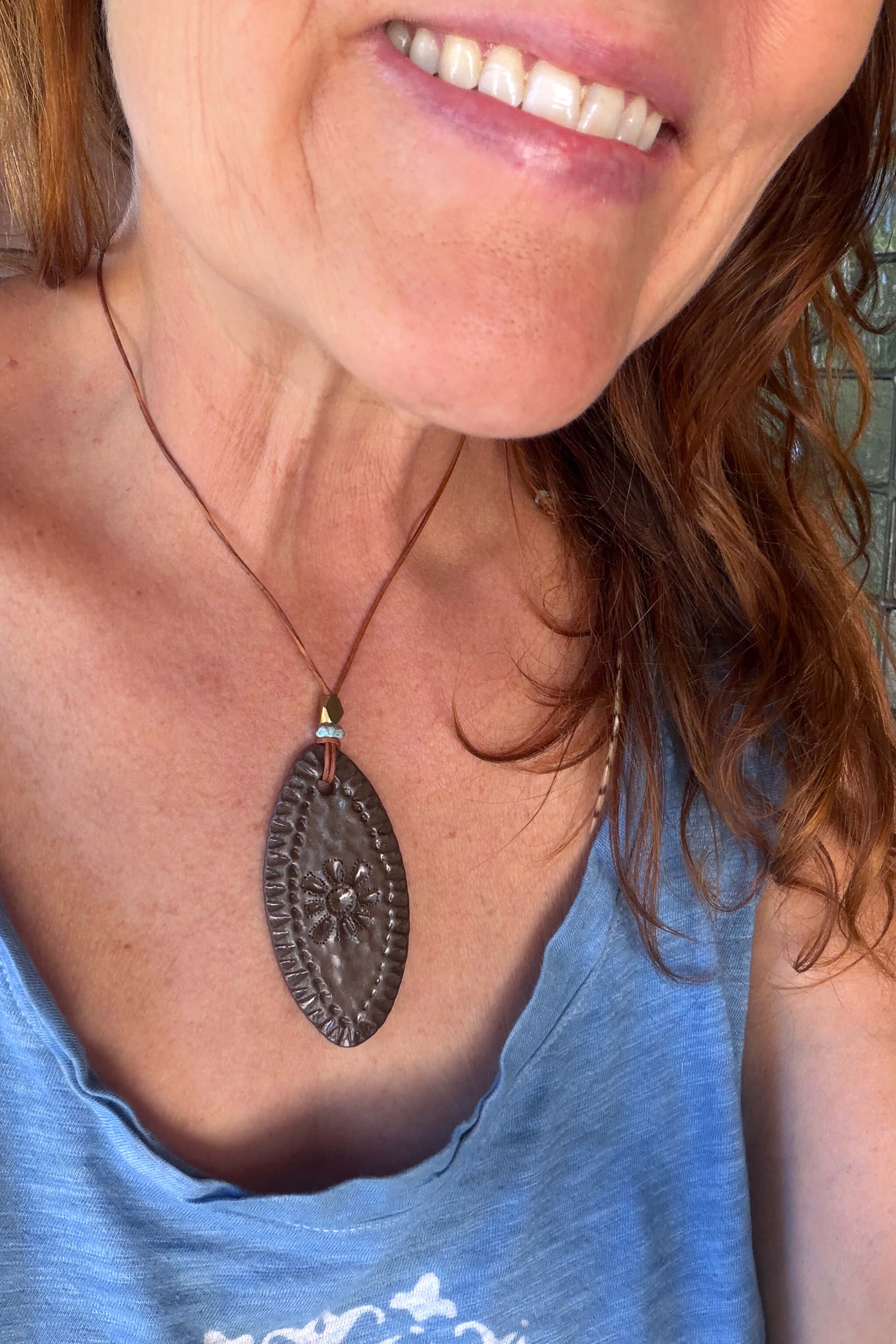 Handmade chocolate terracotta ceramic oval amulet pendant necklace worn at shorter length — folk inspired ceramic jewelry From the Fire FTF_0726 by Jester Swink