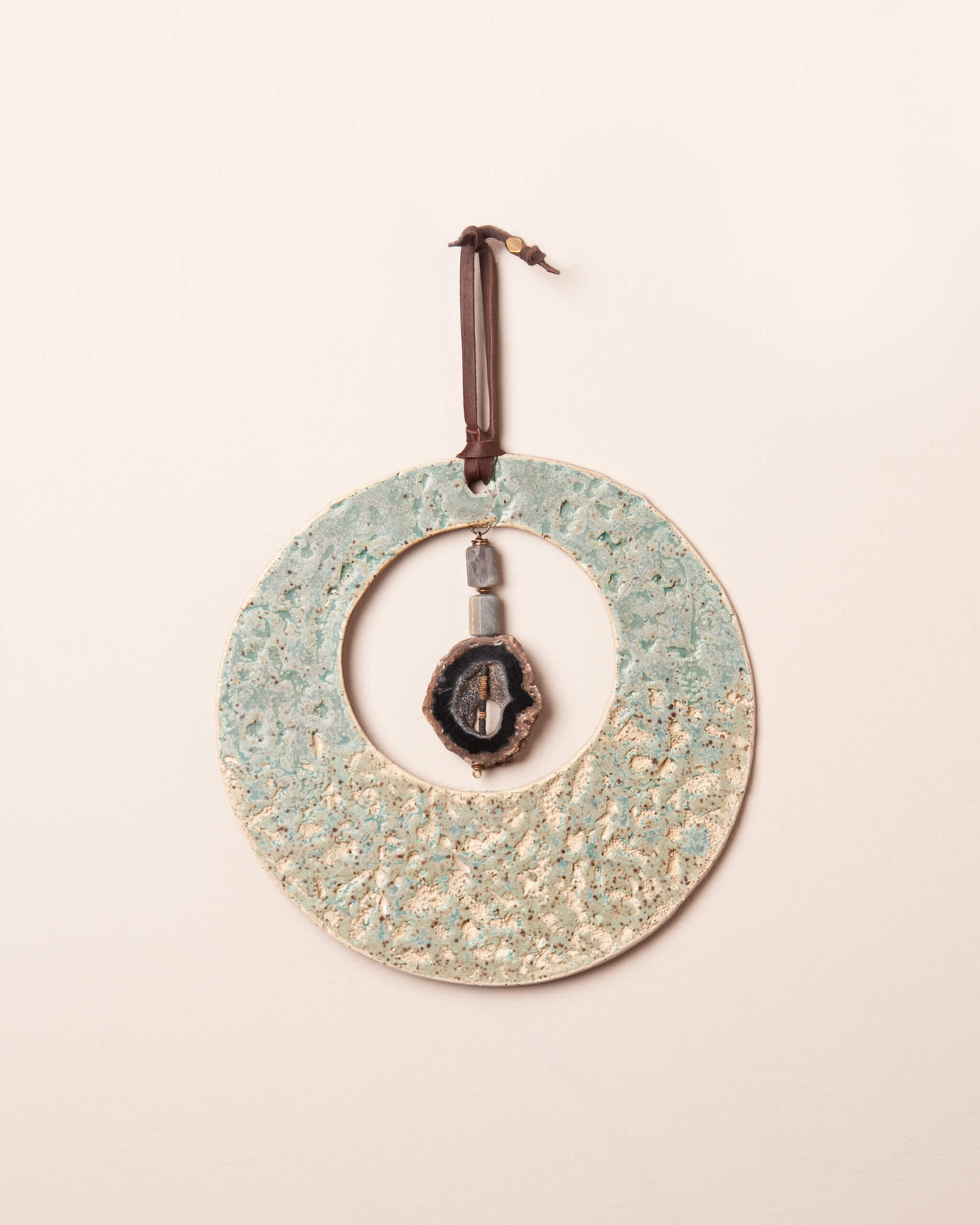 Abalone Moon handmade ceramic wall hanging with abalone and coral impressions, seafoam gradient glaze, made in the Santa Cruz Mountains of California