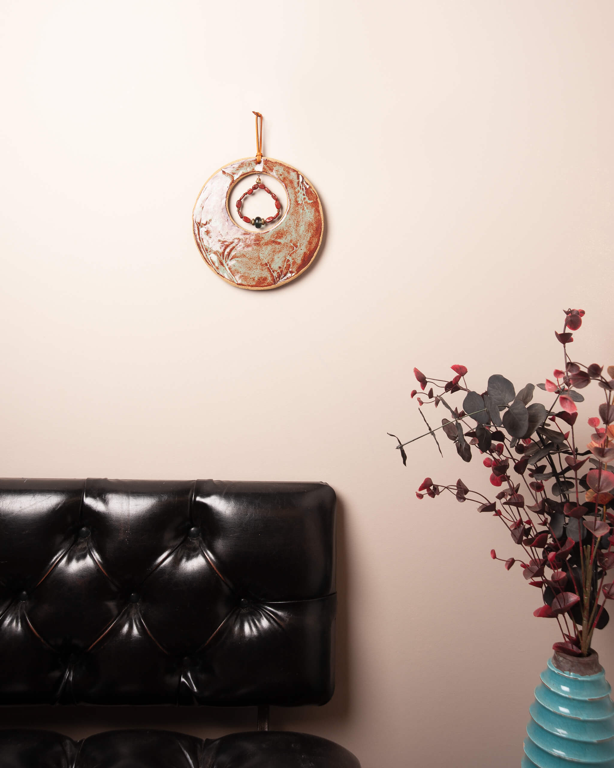 Meadow Moon handmade ceramic wall art with jasper and fluorite in natural home setting
