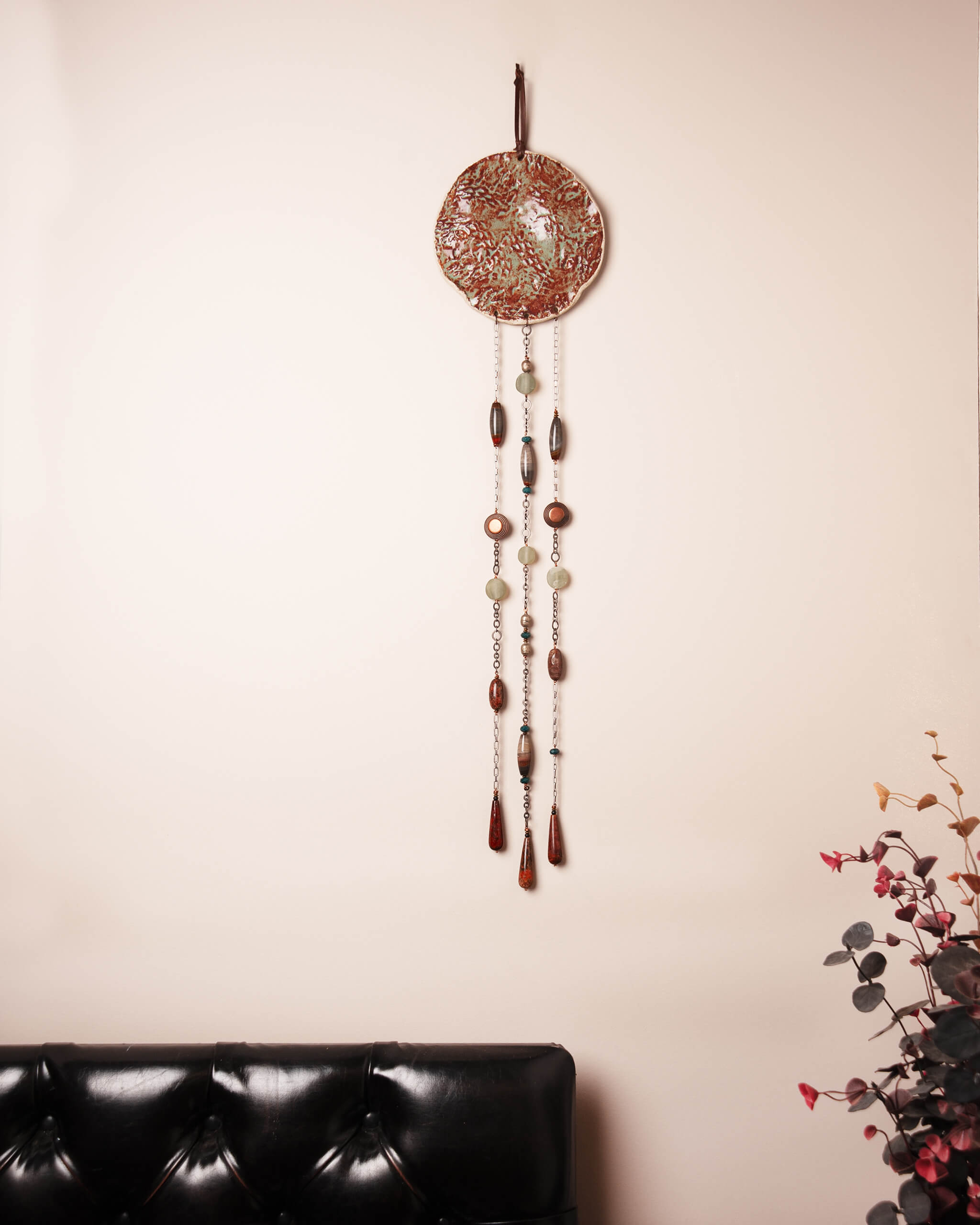 Redwood Rain large handmade ceramic wall art displayed in home setting showing full three strand cascade and nearly three feet of coastal inspired wall presence