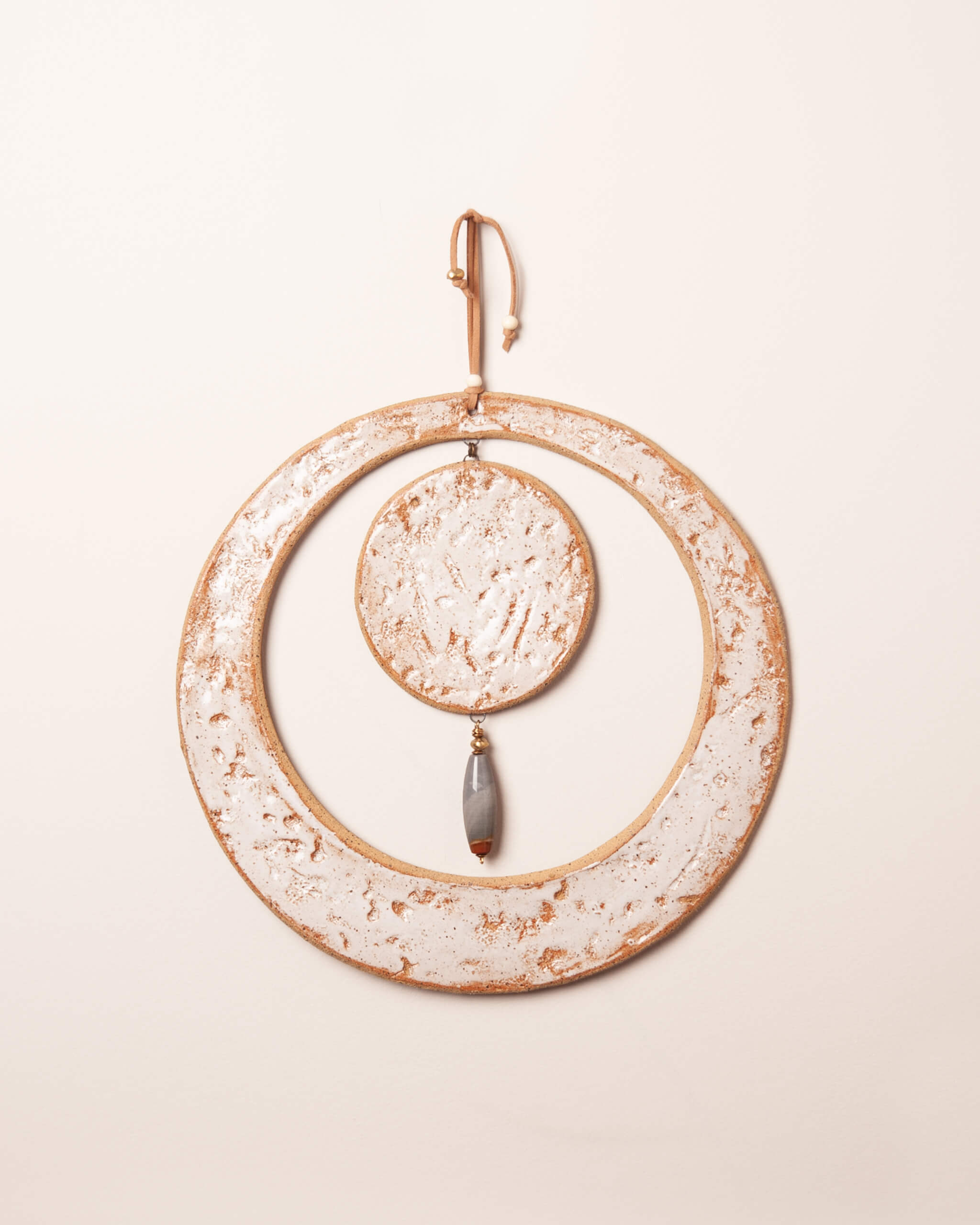 Solstice Moon large handmade ceramic wall hanging with abalone and coral impressions, white frost glaze and inner ceramic disc, made in the Santa Cruz Mountains of California
