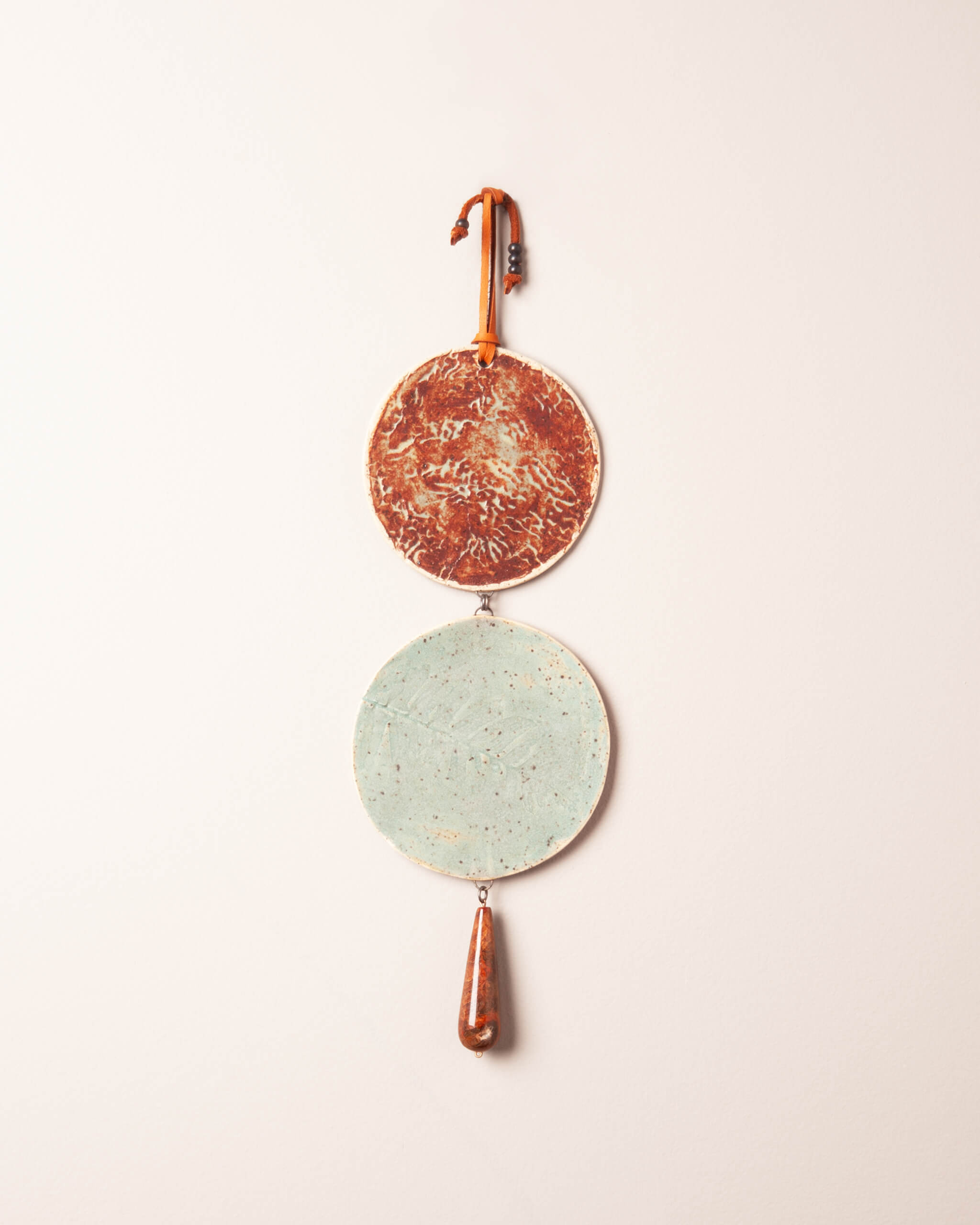 Tide and Fern Cascade handmade ceramic wall hanging with sea kelp and fern impressions, rusty terracotta and seafoam glaze, made in the Santa Cruz Mountains of California