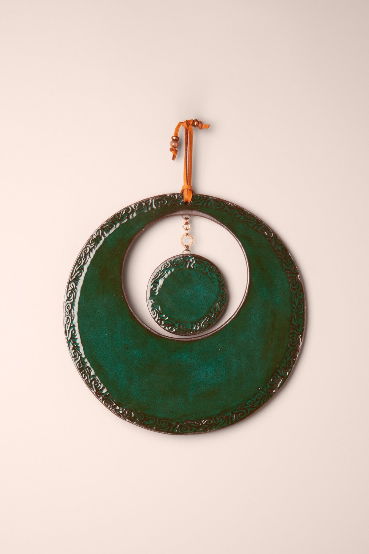 Large handmade circle ceramic wall hanging in vivid Emerald glaze shaped like a crescent moon, with a full moon disc on a copper chain in the open center, kiln fired by Jester Swink Santa Cruz Mountains — From the Fire FTF_1026