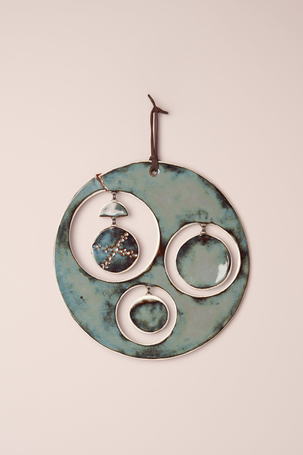 Large handmade circle ceramic wall hanging in Sea Breeze glaze on porcelain with hanging moon phases, made in the wabi sabi style by Jester Swink Santa Cruz Mountains — From the Fire FTF_1026