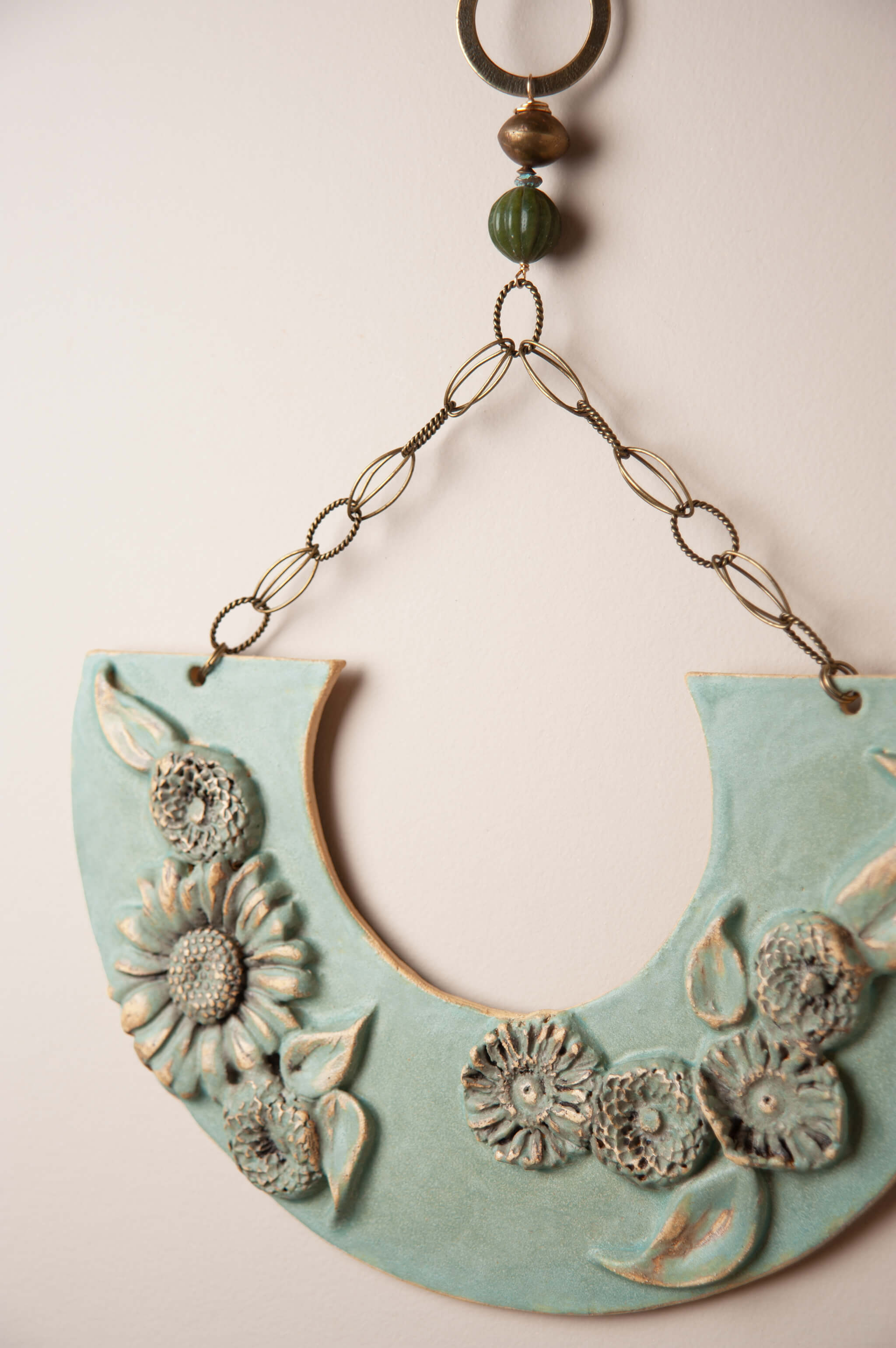 Detail of dimensional handmade ceramic flowers on large floral wall plaque by Jester Swink, Santa Cruz Mountains California — From the Fire FTF_0726