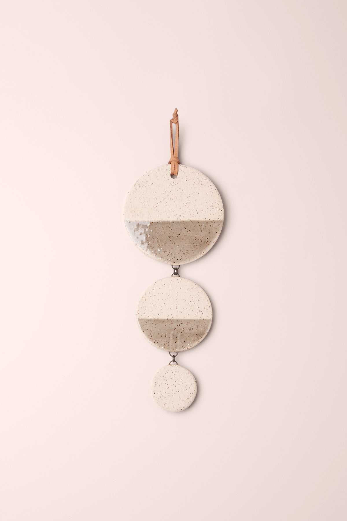 Medium handmade tiered ceramic wall hanging with three stepped speckled discs, the top two split in smoke grey and glossy speckle, kiln fired by Jester Swink Santa Cruz Mountains — From the Fire FTF_1026