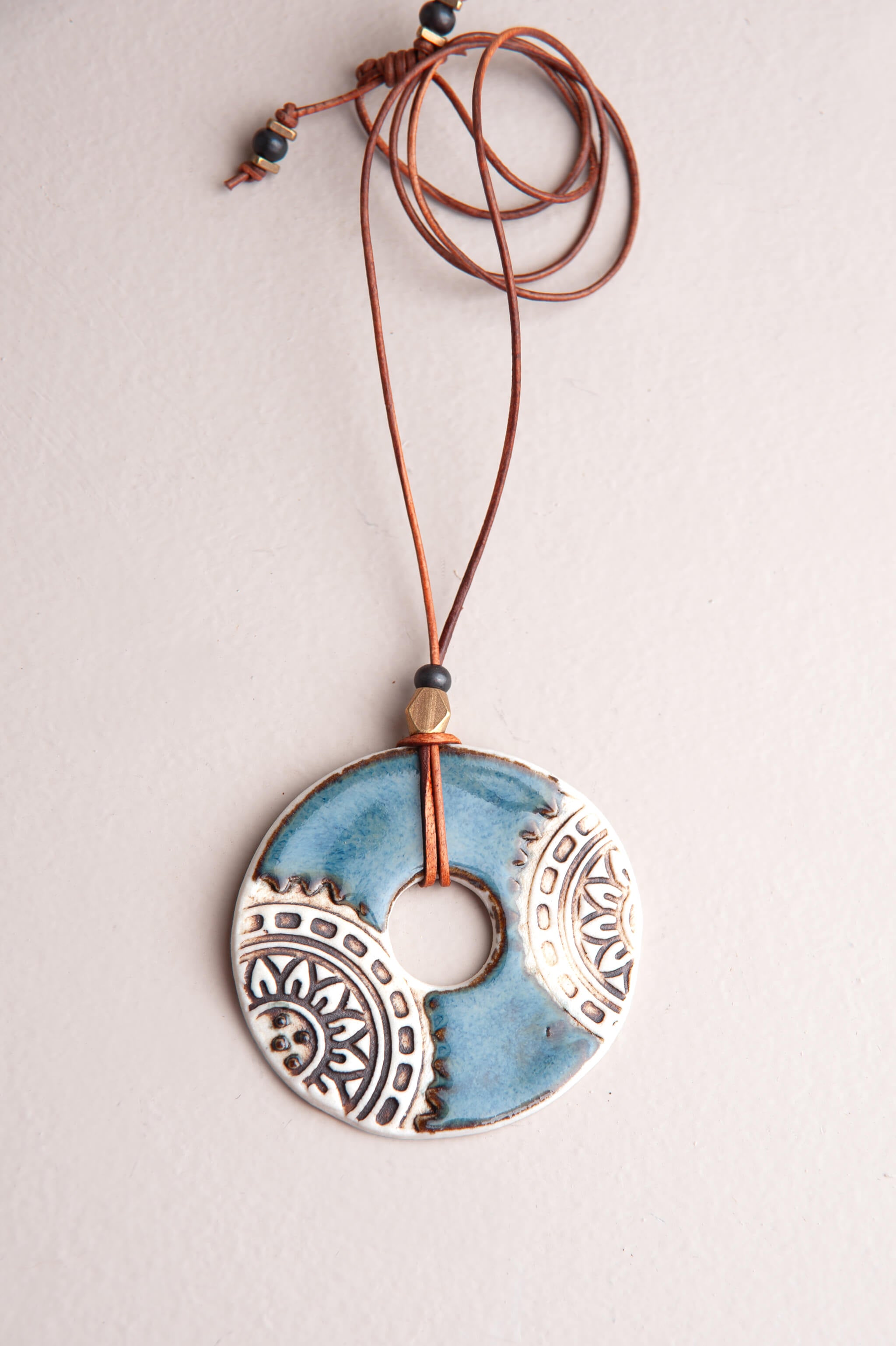 Handmade porcelain mandala ceramic pendant necklace in sea breeze blue and matte white on caramel Italian leather, kiln fired by Jester Swink Santa Cruz Mountains — From the Fire FTF_0726