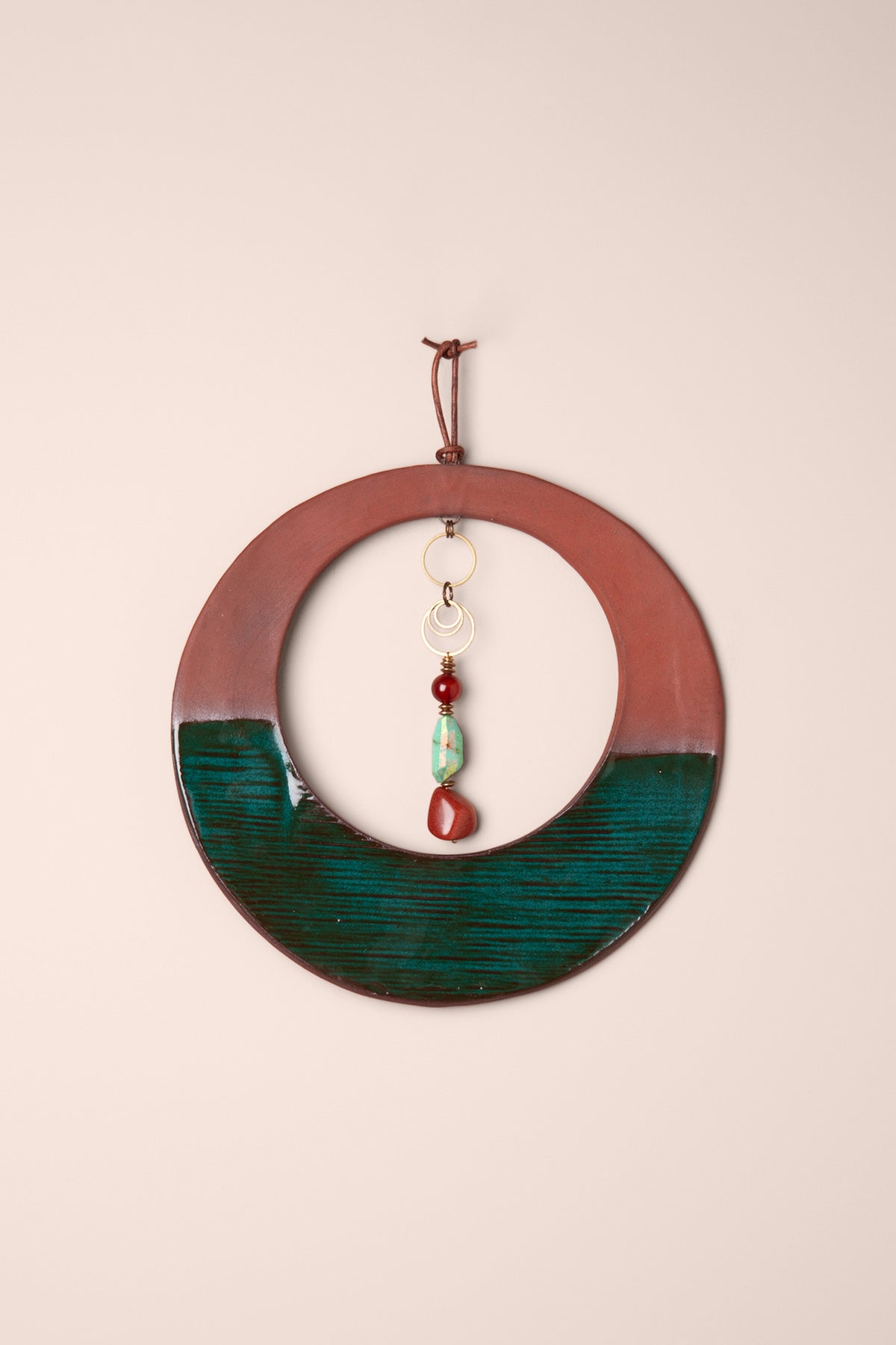 Medium handmade circle ceramic wall hanging in terracotta and Emerald glaze with Peruvian turquoise, carnelian and goldstone, kiln fired by Jester Swink Santa Cruz Mountains — From the Fire FTF_1026