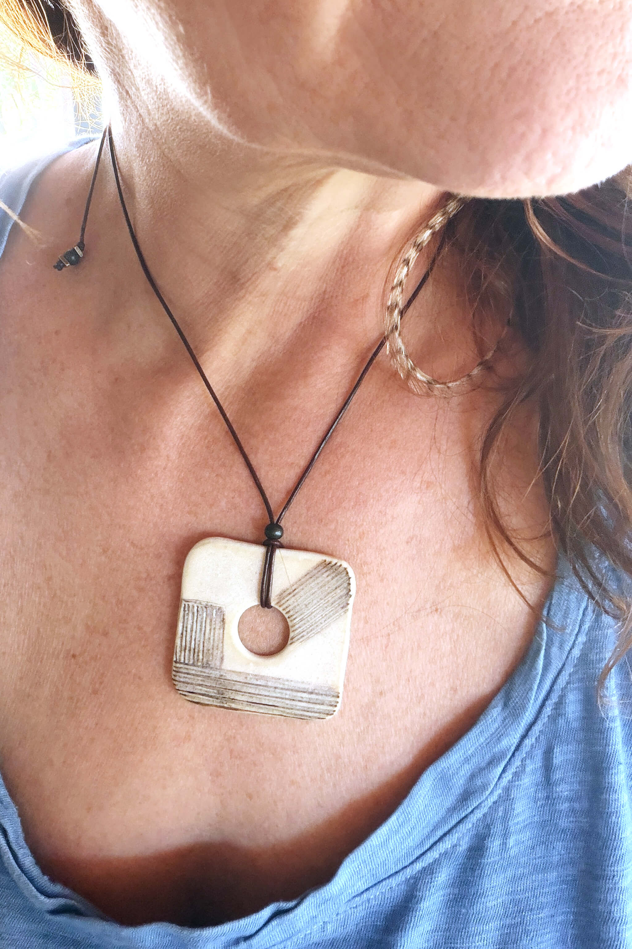 Handmade modern ceramic square pendant necklace worn at shorter length — modern ceramic jewelry From the Fire FTF_0726 by Jester Swink