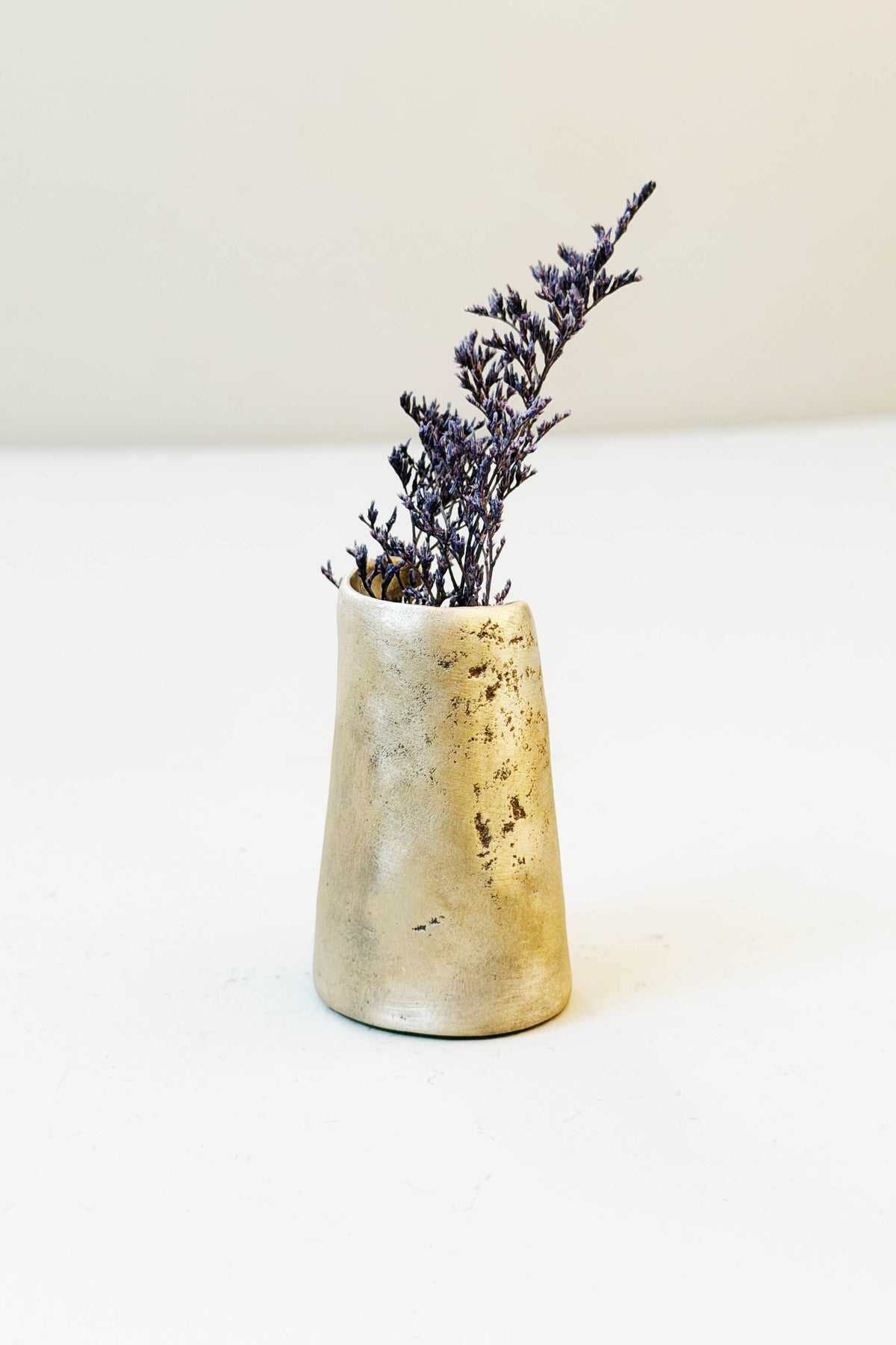 Side of the Persimmon Top bronze mini bud vase showing a few small natural bronze pits from firing, handmade by Jester Swink, Santa Cruz Mountains — From the Fire FTF_1026