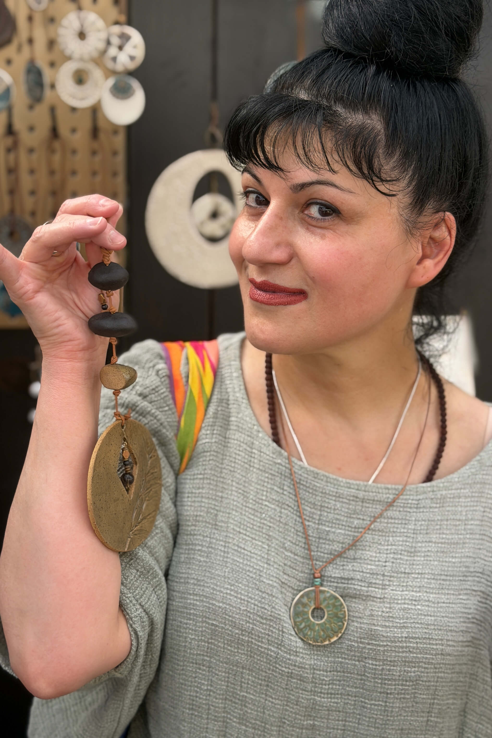 Handmade ceramic aquamarine raindrop pendant necklace worn by collector at Los Altos Art and Wine Festival — From the Fire FTF_0726 by Jester Swink