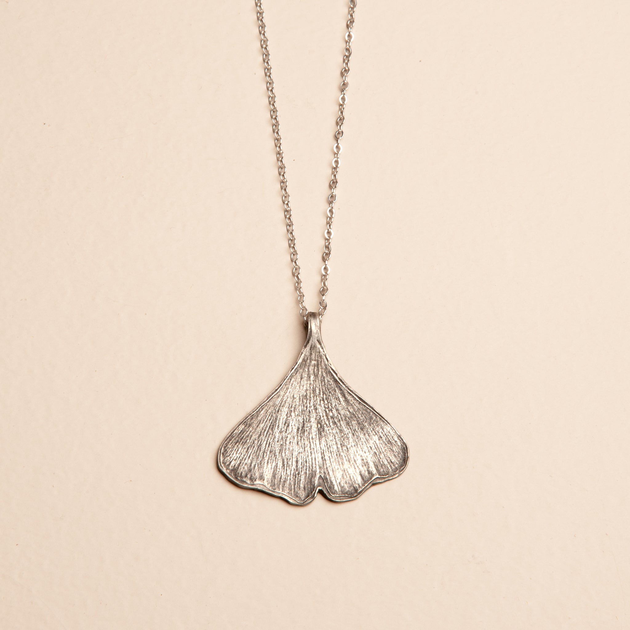 Handcrafted sterling silver ginkgo leaf necklace with botanical imprint pendant on delicate chain
