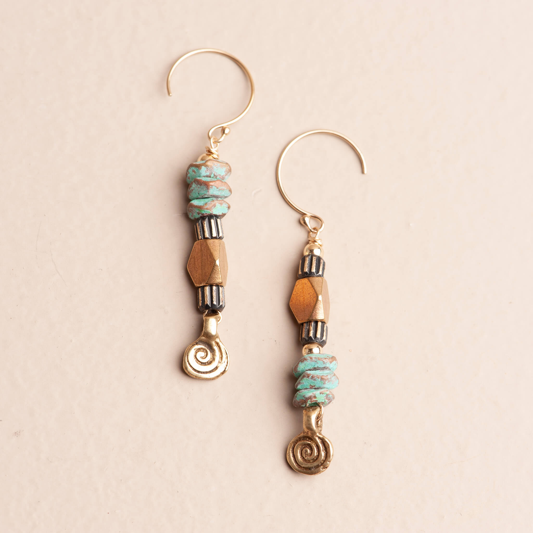 Handmade turquoise patina brass spiral dangle earrings with asymmetrical design, artistic jewelry by Jester Swink